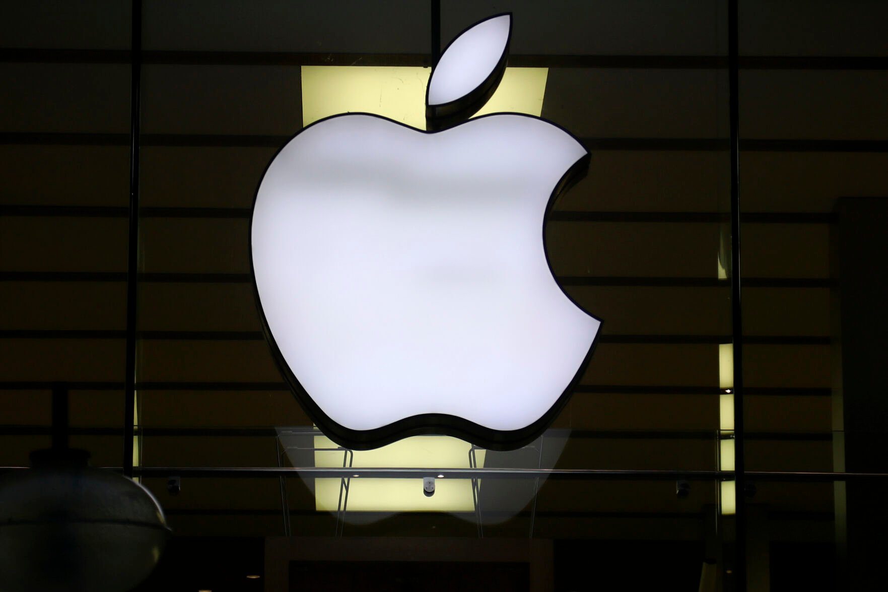 <p>FILE - The Apple logo is illuminated at a store in the city center in Munich, Germany, on Dec. 16, 2020. Apple Corp. shares have been sliding, Friday, Sept. 8, 2023 weighed down by news reports of an iPhone ban for Chinese state employees and a product launch next week overshadowed by slick new phones by rival Huawei. (AP Photo/Matthias Schrader, File)</p>   PHOTO CREDIT: Matthias Schrader - staff, ASSOCIATED PRESS
