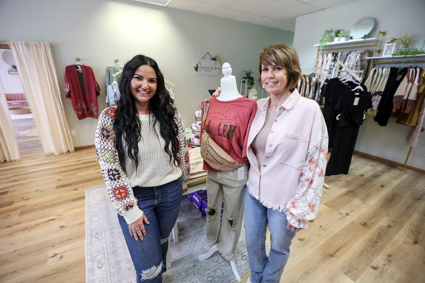Abby Gloeckner (left) and her mom Jan Gloeckner are co-owners of Olive & Opal Clothing Boutique in Dubuque.    PHOTO CREDIT: Dave Kettering