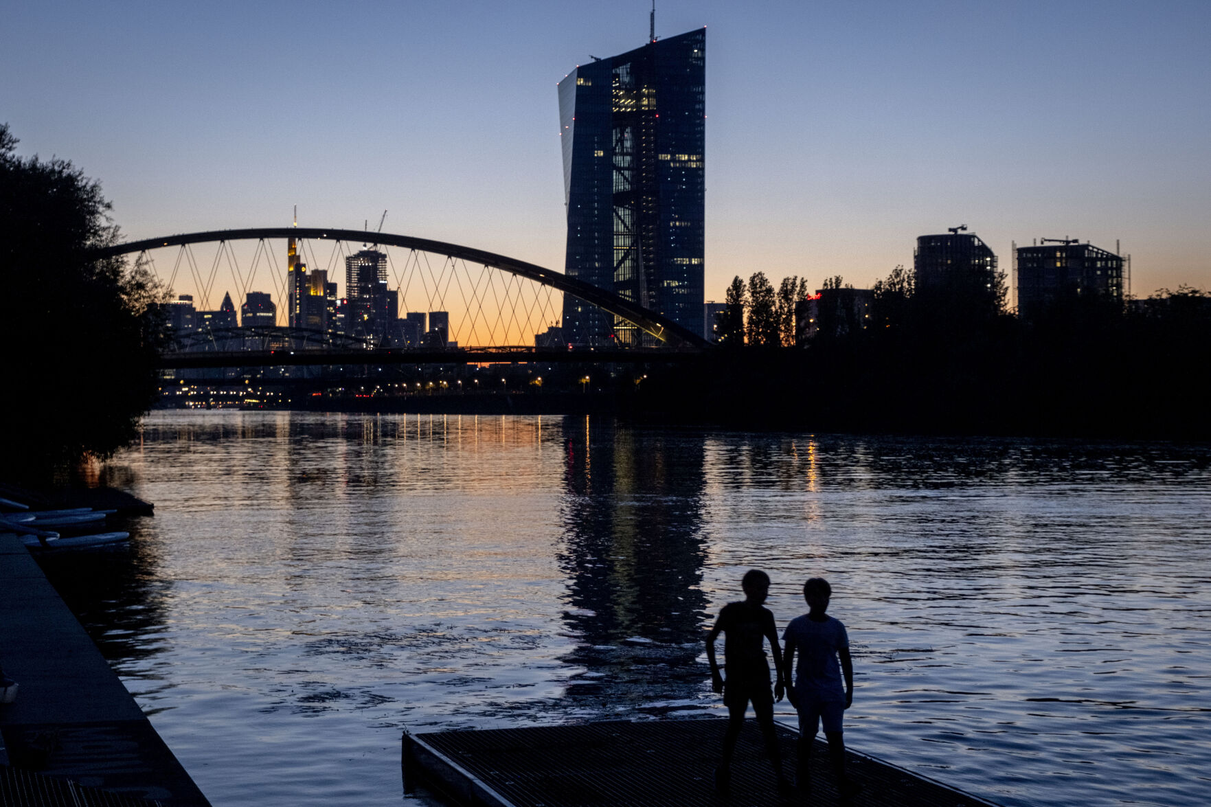 <p>Two boys stand at the river Main near the European Central Bank in Frankfurt, Germany, after sunset on Friday, Sept. 8, 2023. (AP Photo/Michael Probst)</p>   PHOTO CREDIT: Michael Probst 