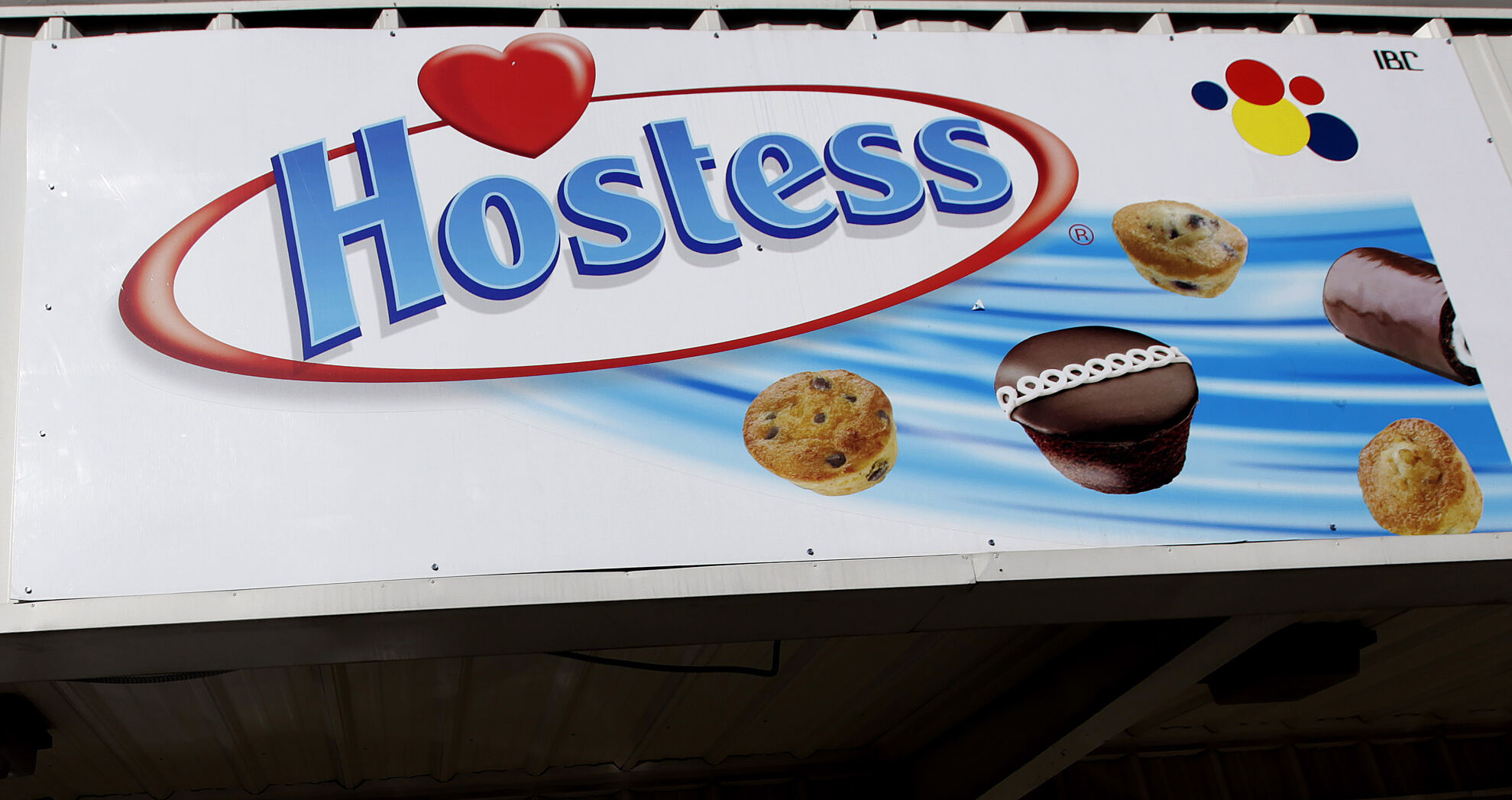 <p>FILE - A Hostess sign is shown on a closed retail outlet store in Garland, Texas, Jan. 11, 2012. Hostess, the maker of snack classics like Twinkies and HoHos, is being sold to J.M. Smucker in a cash-and-stock deal worth about $5.6 billion. Smucker, which makes everything from coffee to peanut butter and jelly, will pay $34.25 per share in cash and stock, and it will also pick up approximately $900 million in net debt. (AP Photo/LM Otero, file)</p>   PHOTO CREDIT: LM Otero 