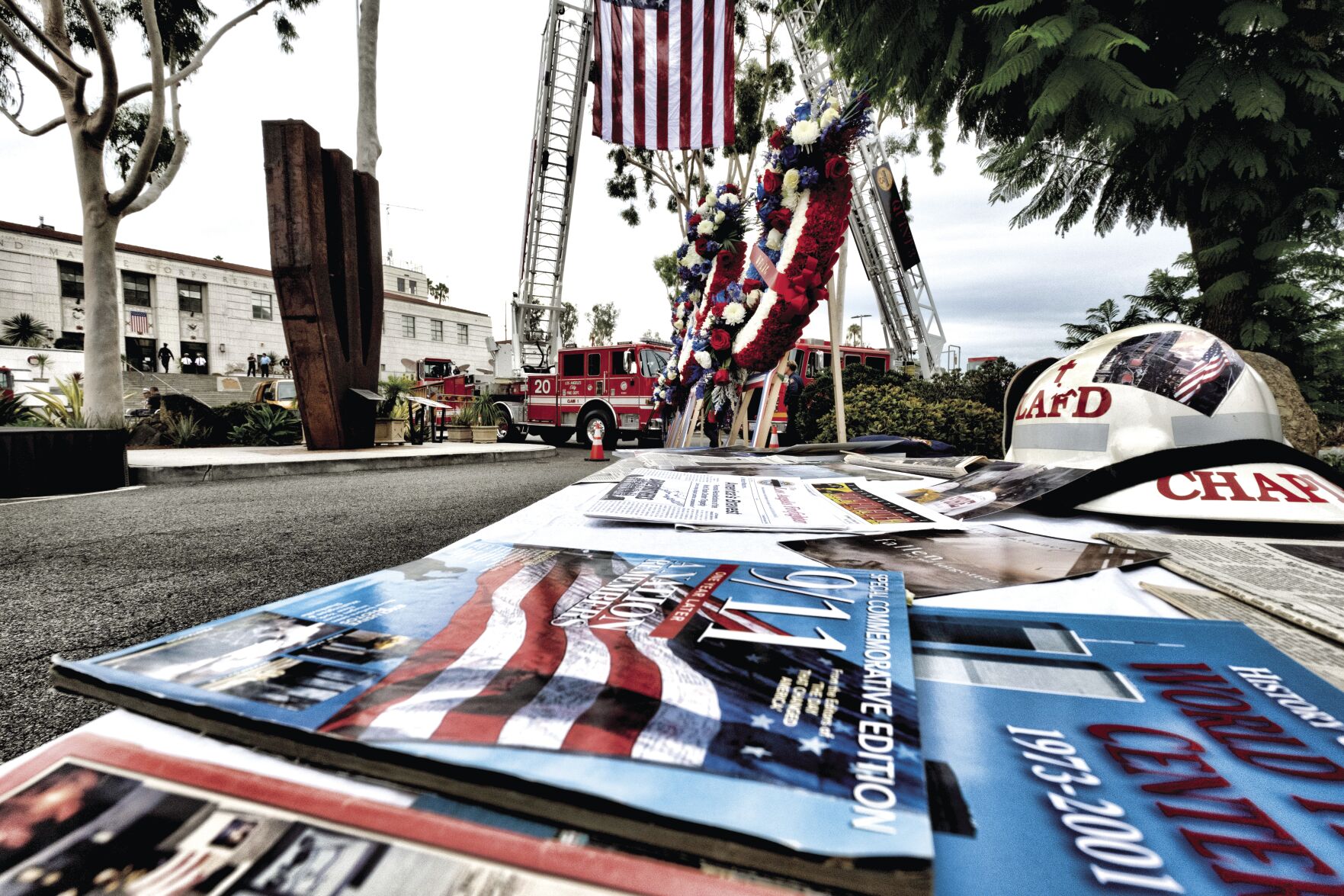 Memorial wreaths stand by section of the south tower of the World Trade Center during a 9-11 Remembrance Ceremony at the Los Angeles City Fire Department Frank Hotchkin Memorial Training Center on Monday, Sept. 11, 2023. (AP Photo/Richard Vogel)    PHOTO CREDIT: Richard Vogel