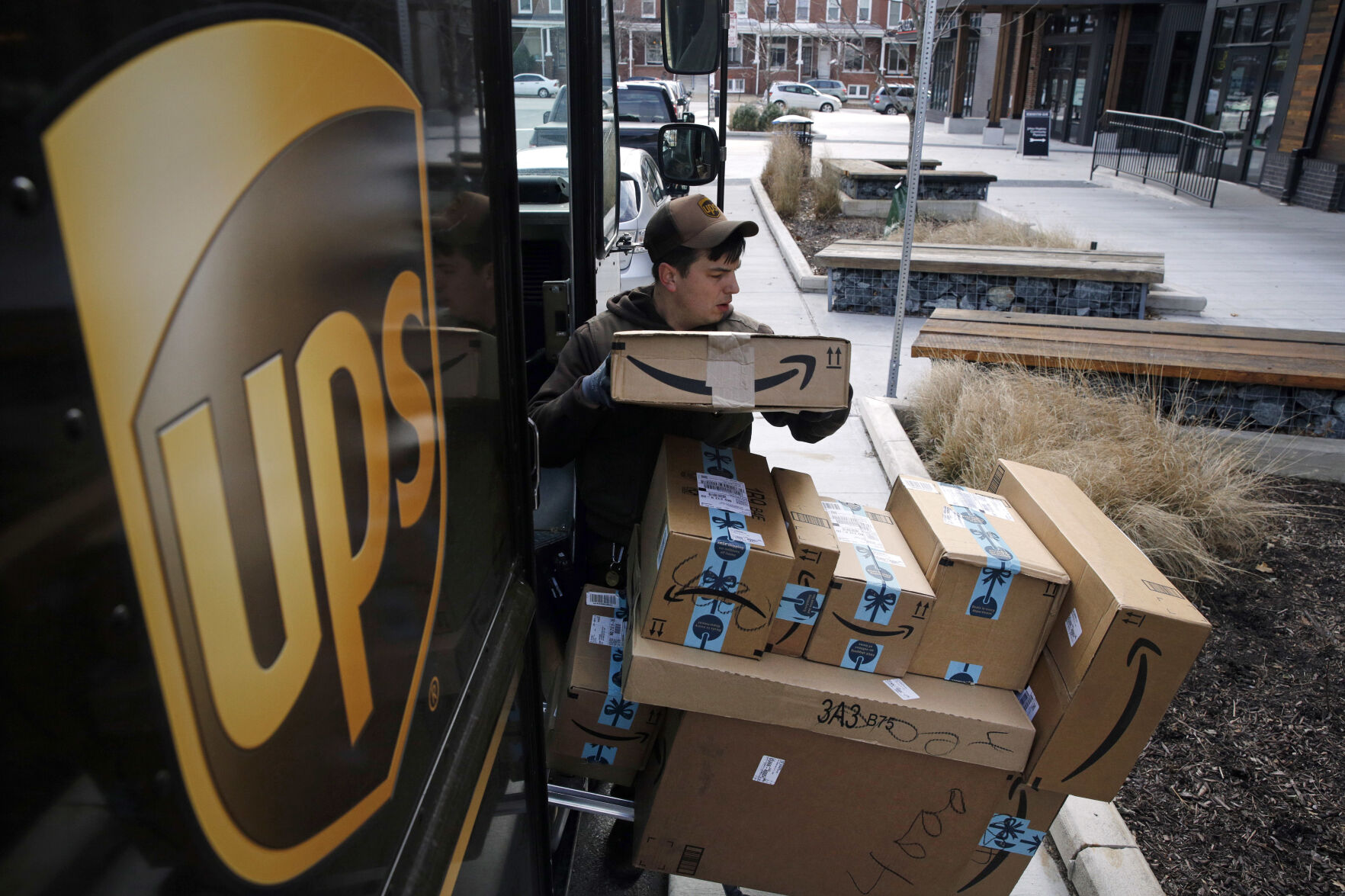 <p>FILE - A UPS driver prepares to deliver packages in Baltimore, Md., Dec. 19, 2018. UPS plans to hire more than 100,000 workers _ at higher pay than a year ago _ to help handle the holiday rush this season, in line with hiring the previous three years. (AP Photo/Patrick Semansky, File)</p>   PHOTO CREDIT: Patrick Semansky 