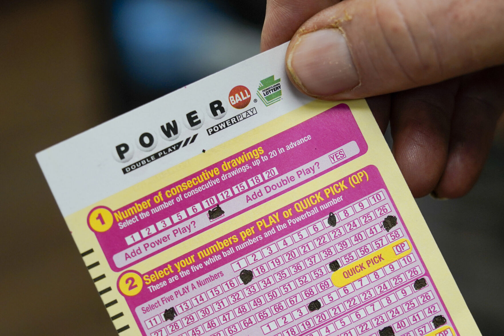 <p>FILE - A person shows his scan card for their personal selection numbers for a ticket for a Powerball drawing on Nov. 7, 2022 in Renfrew, Pa. An $835 million Powerball jackpot will be up for grabs Wednesday, Sept. 27, 2023, for players willing to risk a couple dollars and brave incredibly long odds.(AP Photo/Keith Srakocic, File)</p>   PHOTO CREDIT: Keith Srakocic 
