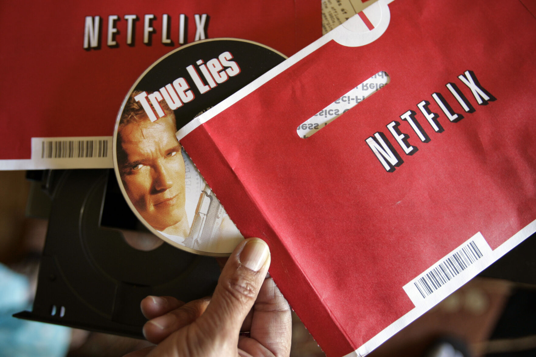 <p>File - Mei Michelson prepares to watch a Netflix DVD at her home in Palo Alto, Calif., on Oct. 22, 2007. The Netflix DVD-by-service will mail out its final discs Friday from its five remaining distribution centers, ending its 25-year history. (AP Photo/Paul Sakuma, File)</p>   PHOTO CREDIT: Paul Sakuma 