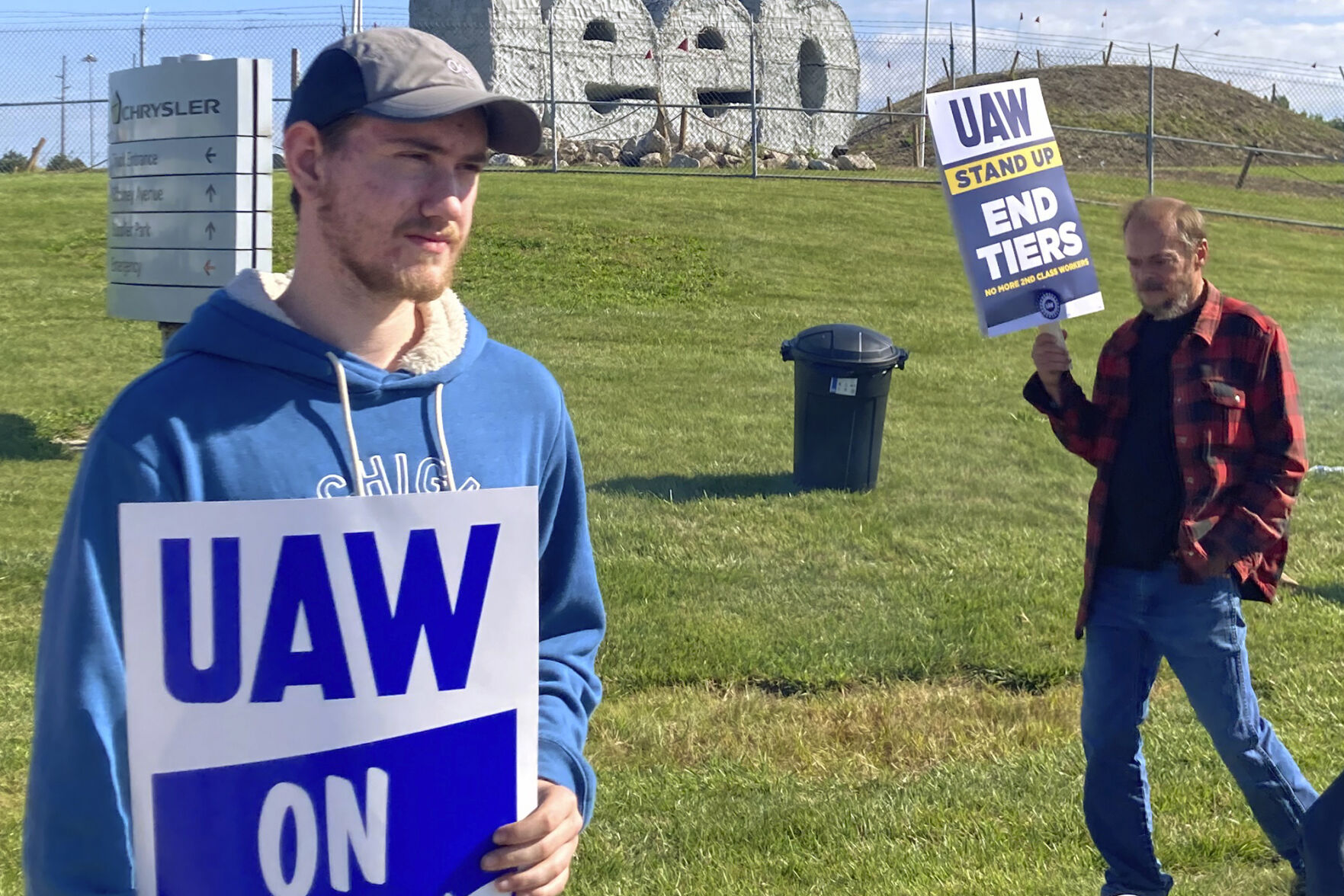 <p>Logan Bohn, a member of the striking United Auto Workers, stands outside the Stellantis plant that makes Jeeps in Toledo, Ohio, on Friday, September 15, 2023. Bohn is a temporary worker at the plant. The UAW is seeking a contract that will end a big disparity in pay for temporary workers. (AP Photo/John Seewer)</p>   PHOTO CREDIT: John Seewer 