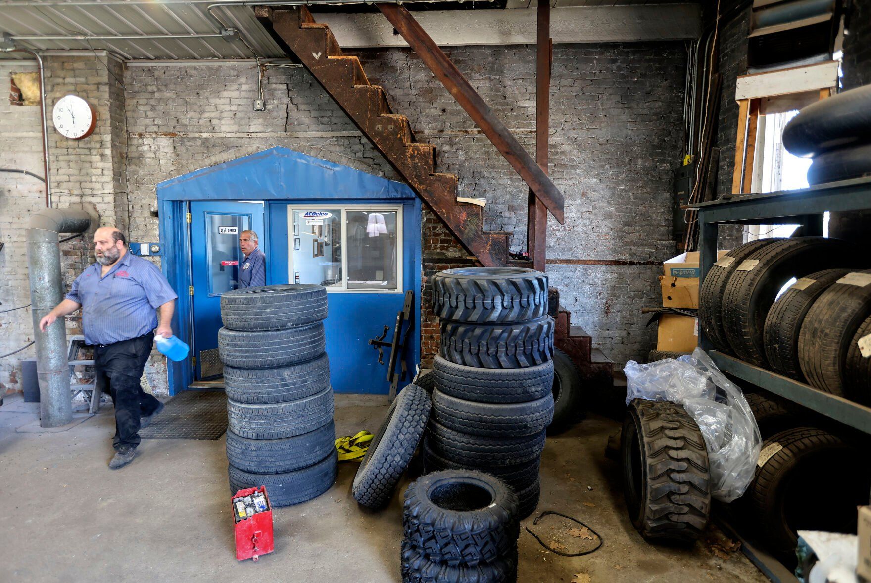Tom Spoerl (left) and his father, John, go to work in the garage at Spoerl Automotive in Sherrill, Iowa. The business has been operating at the same location since 1917.    PHOTO CREDIT: Dave Kettering
Telegraph Herald