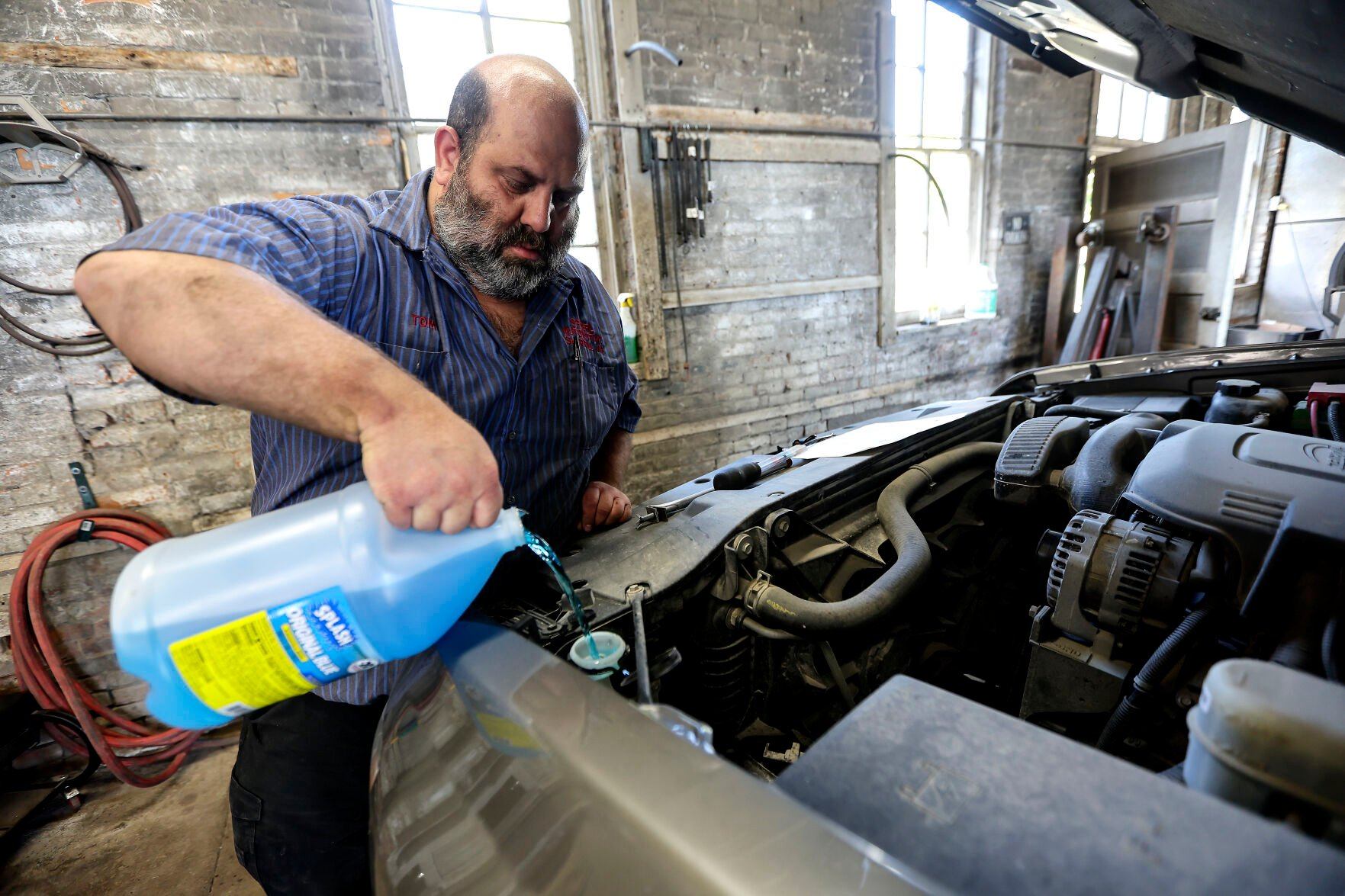 Tom Spoerl works on a truck at Spoerl Automotive in Sherrill, Iowa. The business has been operating at the same location since 1917.    PHOTO CREDIT: Dave Kettering
Telegraph Herald