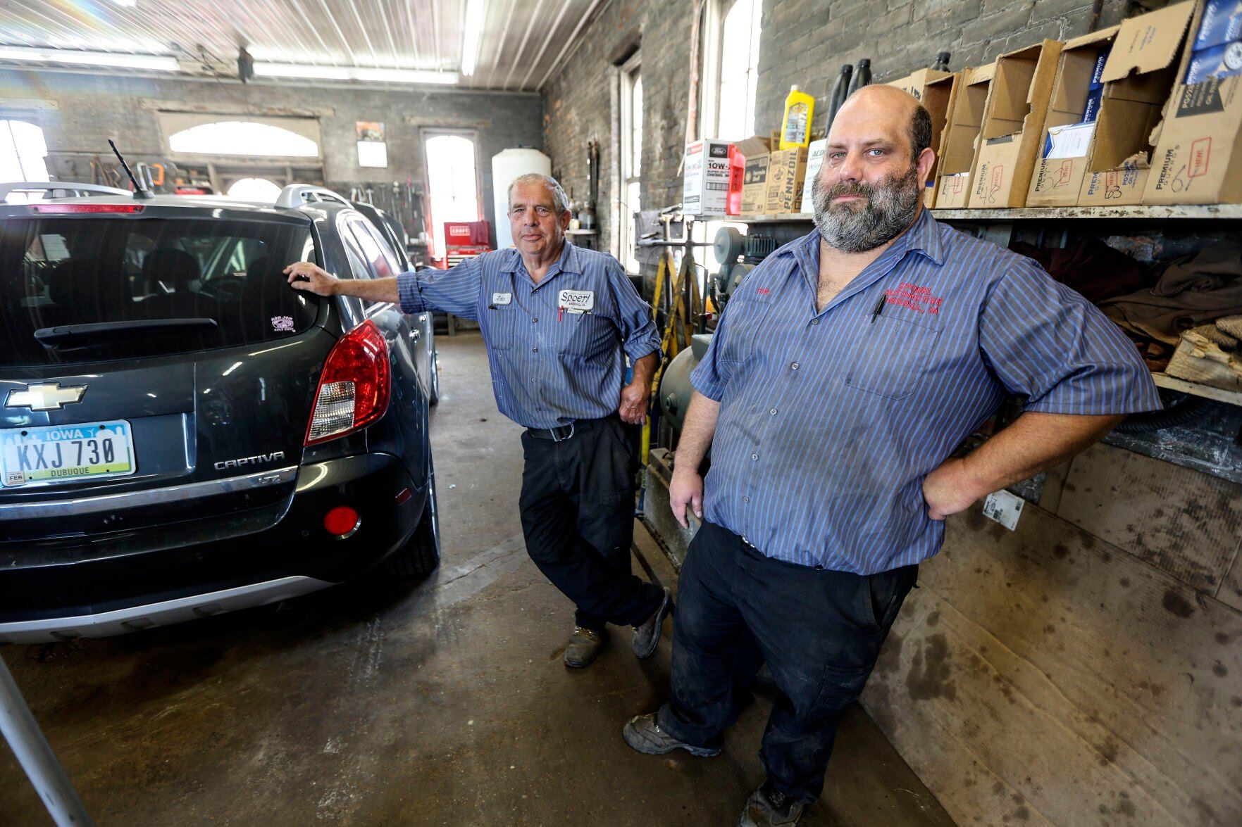 John Spoerl (left) and his son, Tom, work in the garage at Spoerl Automotive in Sherrill, Iowa. The business has been operating at the same location since 1917 and is now under its fourth generation of ownership.    PHOTO CREDIT: Dave Kettering
Telegraph Herald