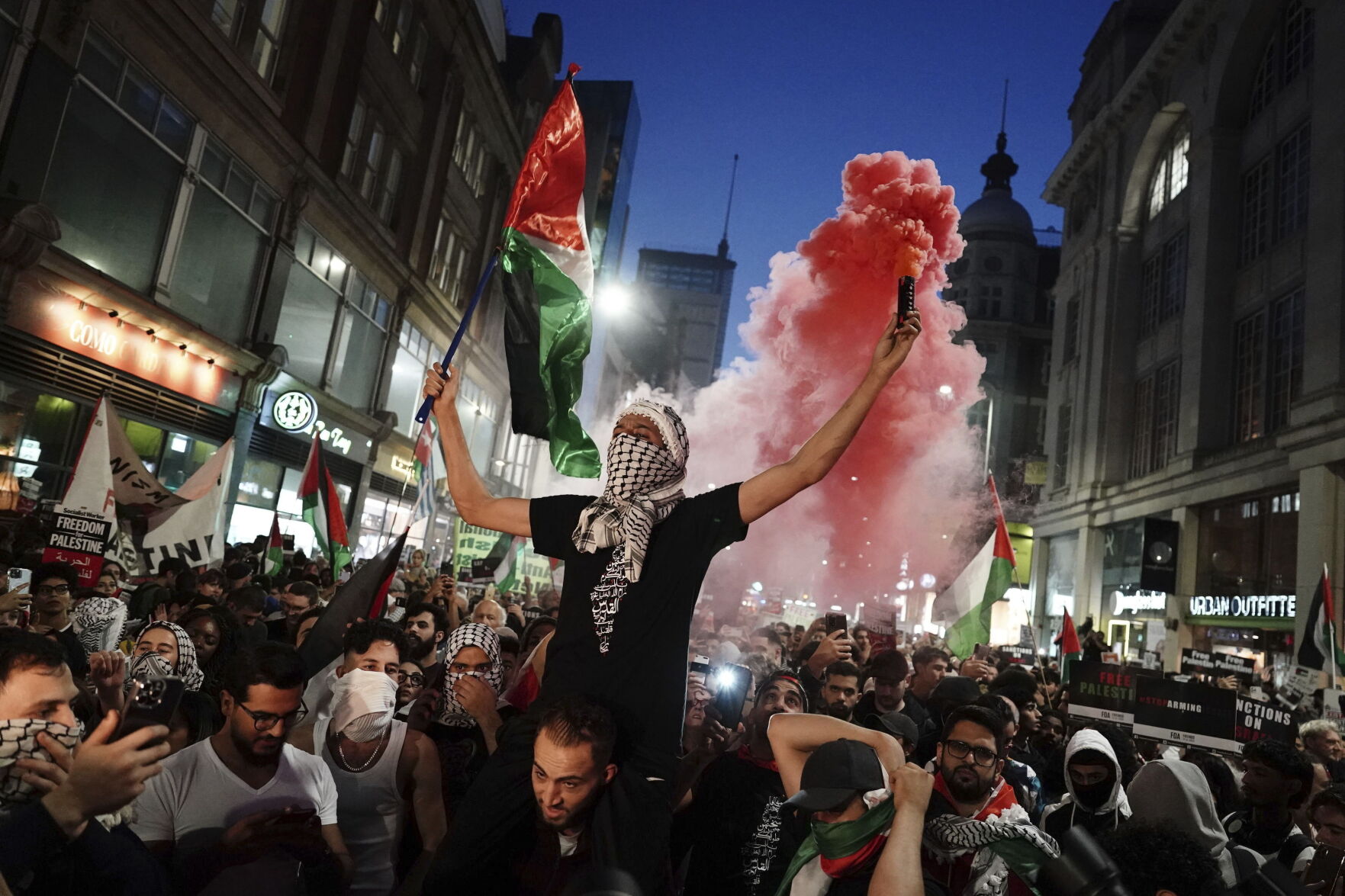 <p>People take part in a Palestine Solidarity Campaign demonstration near the Israeli Embassy, in Kensingston, London, as the death toll rises amid ongoing violence in Israel and Gaza following the attack by Hamas, Monday, Oct. 9, 2023. (Jordan Pettitt/PA via AP)</p>   PHOTO CREDIT: Jordan Pettitt - foreign subscriber, ASSOCIATED PRESS