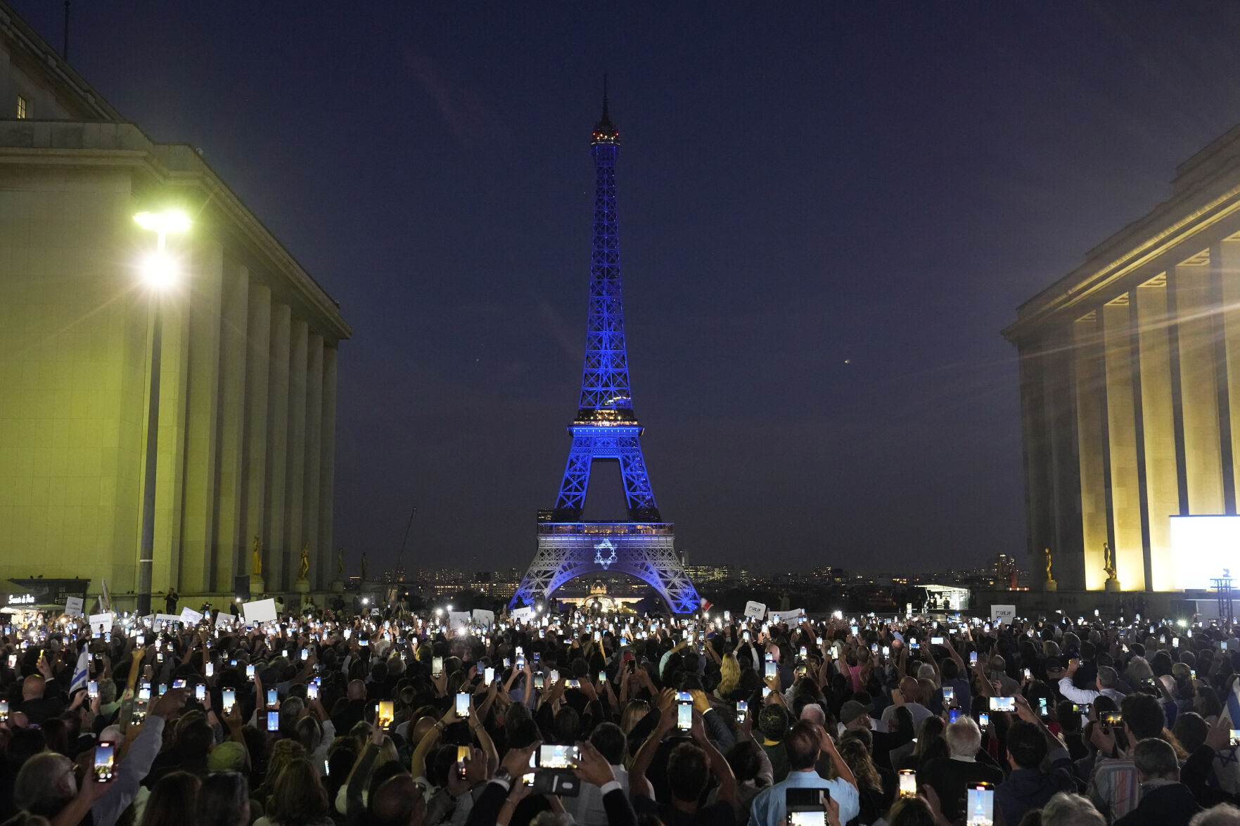 <p>The Eiffel Tower is illuminated with the colors of Israel after a demonstration in a show of support for Israel, Monday, Oct. 9, 2023 in Paris, two days after Hamas fighters launched an unprecedented, multi-front attack on Israel which killed more than 700 people. (AP Photo/Michel Euler)</p>   PHOTO CREDIT: Michel Euler - staff, ASSOCIATED PRESS