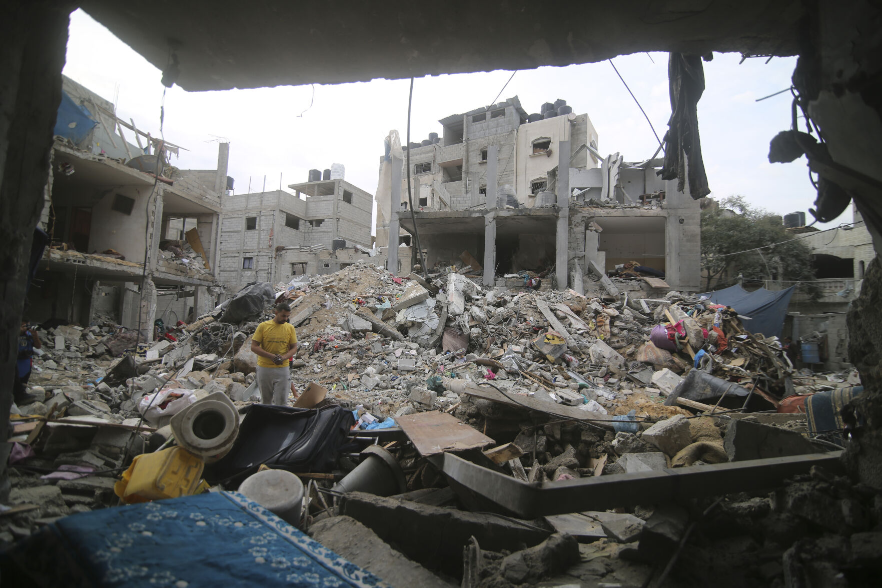 <p>Palestinians inspect the rubble Abu Helal family in Rafah refugee camp, Gaza Strip, Monday, Oct. 9, 2023. The strike killed dozens of people.(AP Photo/Hatem Ali)</p>   PHOTO CREDIT: Hatem Ali 