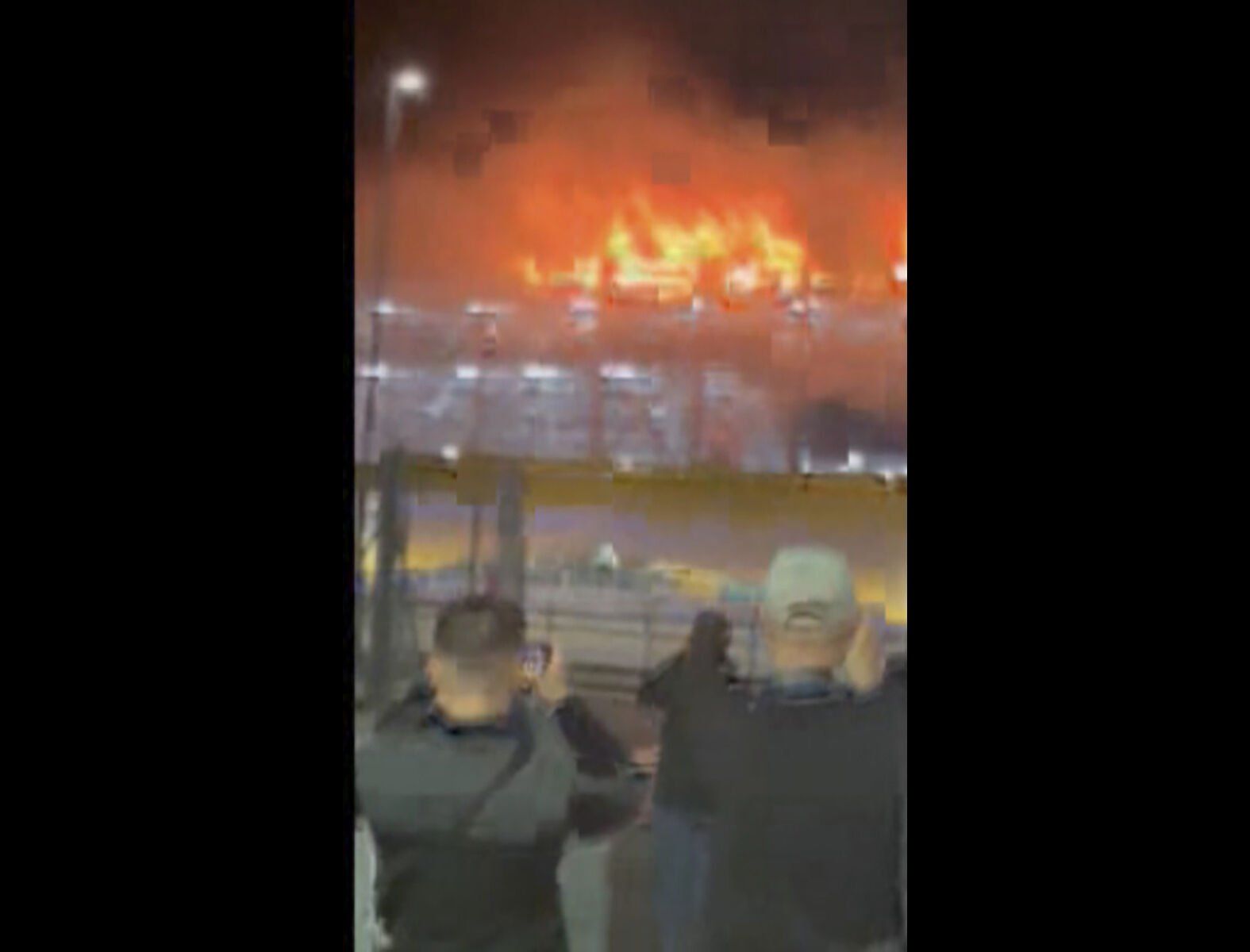 <p>This image taken from video provided by Molly Bullard, shows a fire that broke out in one of the parking lots at Luton Airport, in Luton, England, Tuesday, Oct. 10, 2023. Luton Airport, located about 35 miles (56 kilometers) north of central London, said that “all flights are currently suspended as emergency services respond to a car fire that has spread in Terminal Car Park 2.” (Molly Bullard via AP)</p>   PHOTO CREDIT: Molly Bullard 