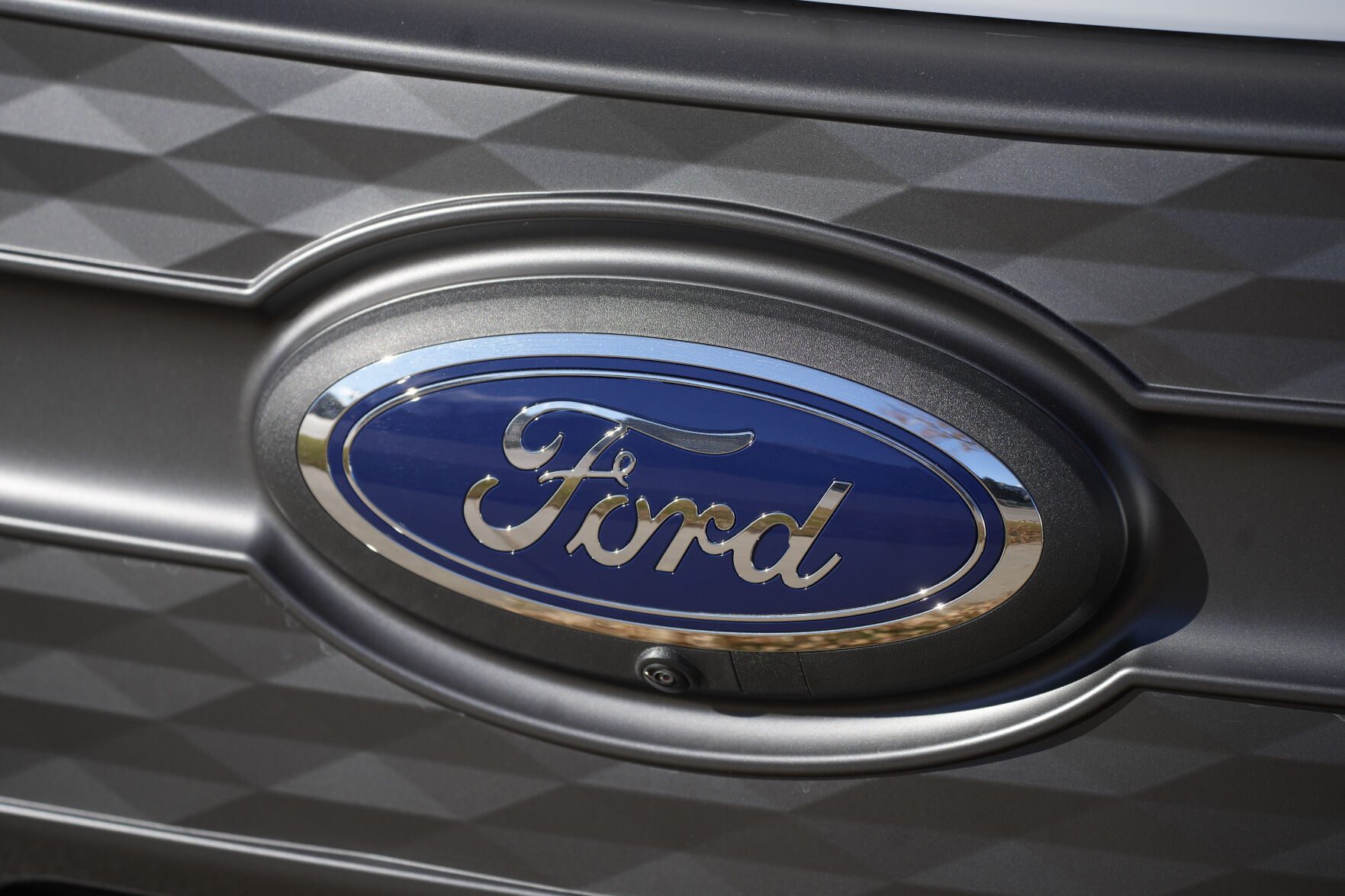 <p>FILE - The Ford company logo is shown on Thursday, Nov. 25, 2022, outside a Ford dealership in southeast Denver. Ford is recalling more than 238,000 Explorers in the U.S. because a rear axle bolt can fail, potentially causing a loss of drive power or allowing the SUVs to roll away while in park. The recall on Friday, Oct. 13, 2023, comes after U.S. safety regulators opened an investigation into the problem after getting two complaints that repairs didn’t work in two previous recalls this year and in 2022. (AP Photo/David Zalubowski, File)</p>   PHOTO CREDIT: David Zalubowski - staff, ASSOCIATED PRESS