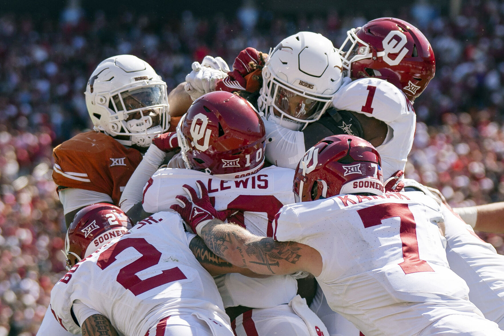 <p>The Oklahoma defense stands up Texas running back Jonathon Brooks on a key goal line stand during the second half of an NCAA college football game at the Cotton Bowl, Saturday, Oct. 7, 2023, in Dallas. Oklahoma won 34-30. (AP Photo/Jeffrey McWhorter)</p>   PHOTO CREDIT: Jeffrey McWhorter