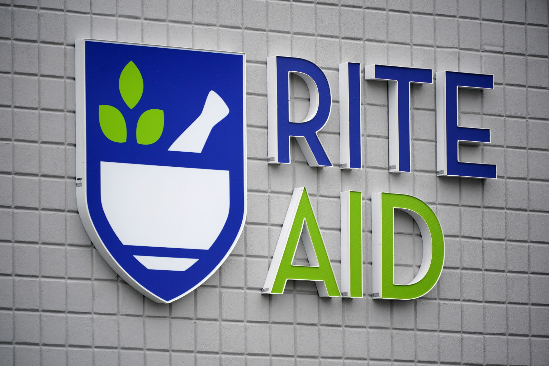 <p>FILE - This photo shows a sign of Rite Aid on its store in Pittsburgh on Jan. 23, 2023. Rite Aid, a major U.S. pharmacy chain, said Sunday, Oct. 15, that it has filed for bankruptcy as part of its effort to restructure its finances. (AP Photo/Gene J. Puskar, File)</p>   PHOTO CREDIT: Gene J. Puskar