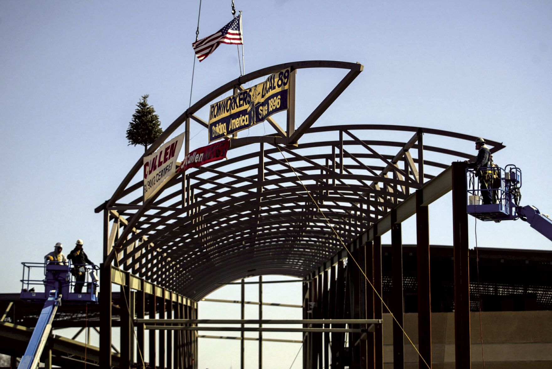 The final piece of structural steel is installed on the Grand River Center in Dubuque during a topping out ceremony in 2003.    PHOTO CREDIT: CLINT AUSTIN