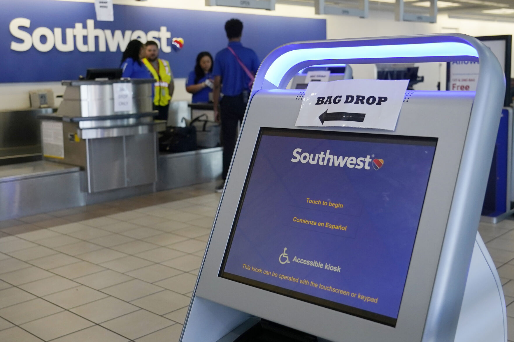<p>FILE - Employees stand by an empty Southwest Airlines ticket counter Tuesday, April 18, 2023, in Oklahoma City. Southwest Airlines reports earnings on Thursday, Oct. 26, 2023 (AP Photo/Sue Ogrocki, File)</p>   PHOTO CREDIT: Sue Ogrocki 