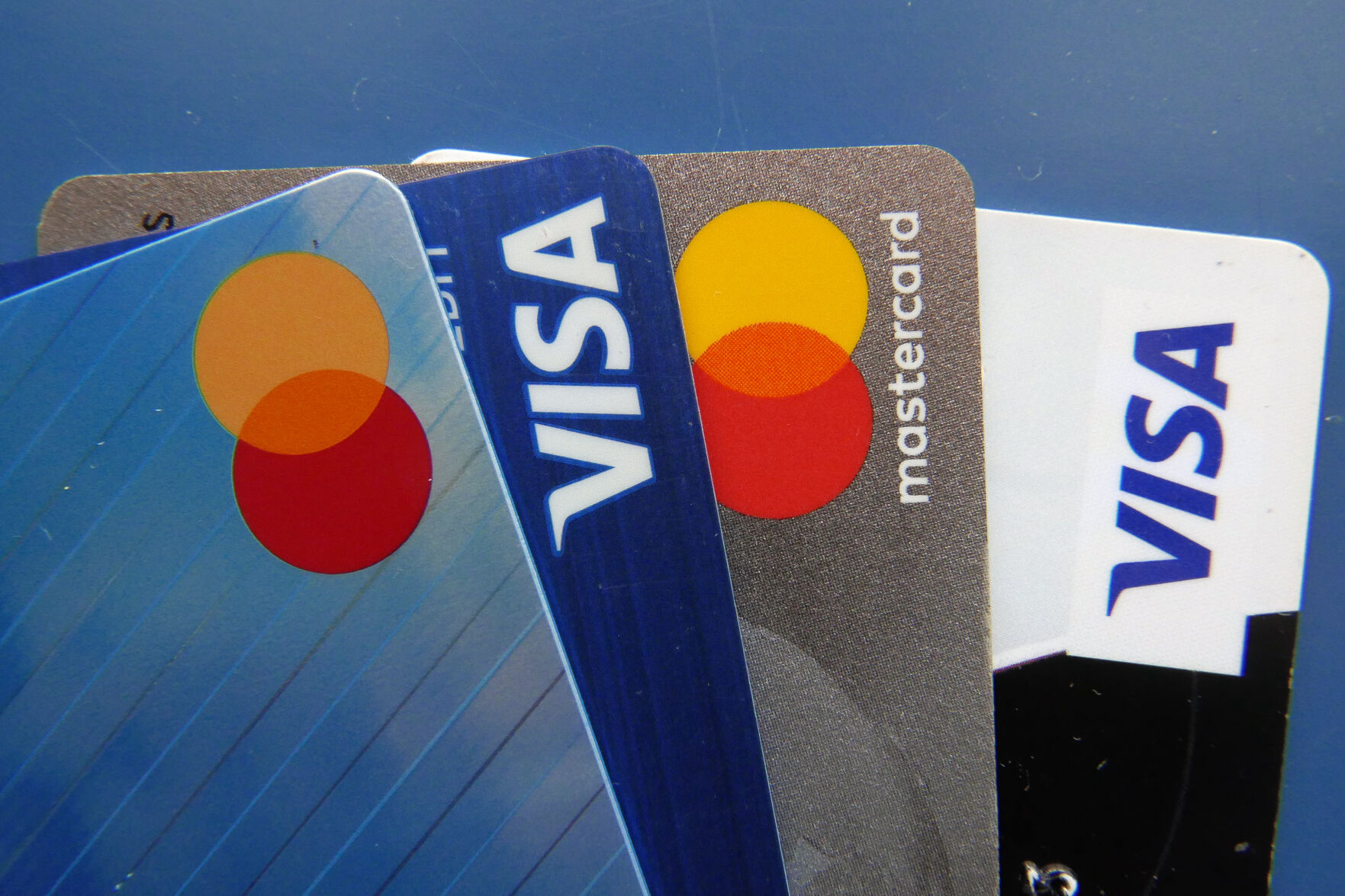 <p>FILE - Credit cards as seen July 1, 2021, in Orlando, Fla. Many Americans say their household expenses are outpacing earnings in 2023 according to a new poll from AP-NORC Center for Public Affairs Research. (AP Photo/John Raoux, File)</p>   PHOTO CREDIT: John Raoux - staff, ASSOCIATED PRESS