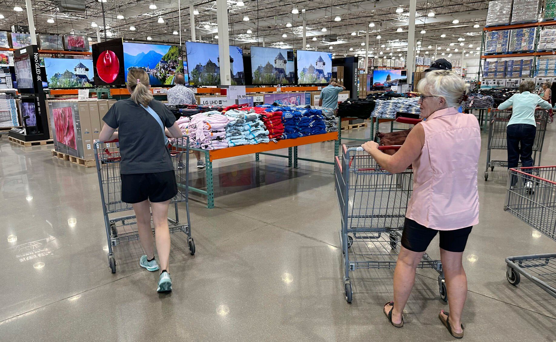 <p>File - Shoppers push carts into a Costco warehouse Friday, Aug. 4, 2023, in Thornton, Colo. A surge in U.S. consumer spending is fueling economic growth, reflecting a resilience among households that has confounded economists, Federal Reserve officials and even the sentiments that Americans themselves have expressed in surveys.(AP Photo/David Zalubowski, File)</p>   PHOTO CREDIT: David Zalubowski 