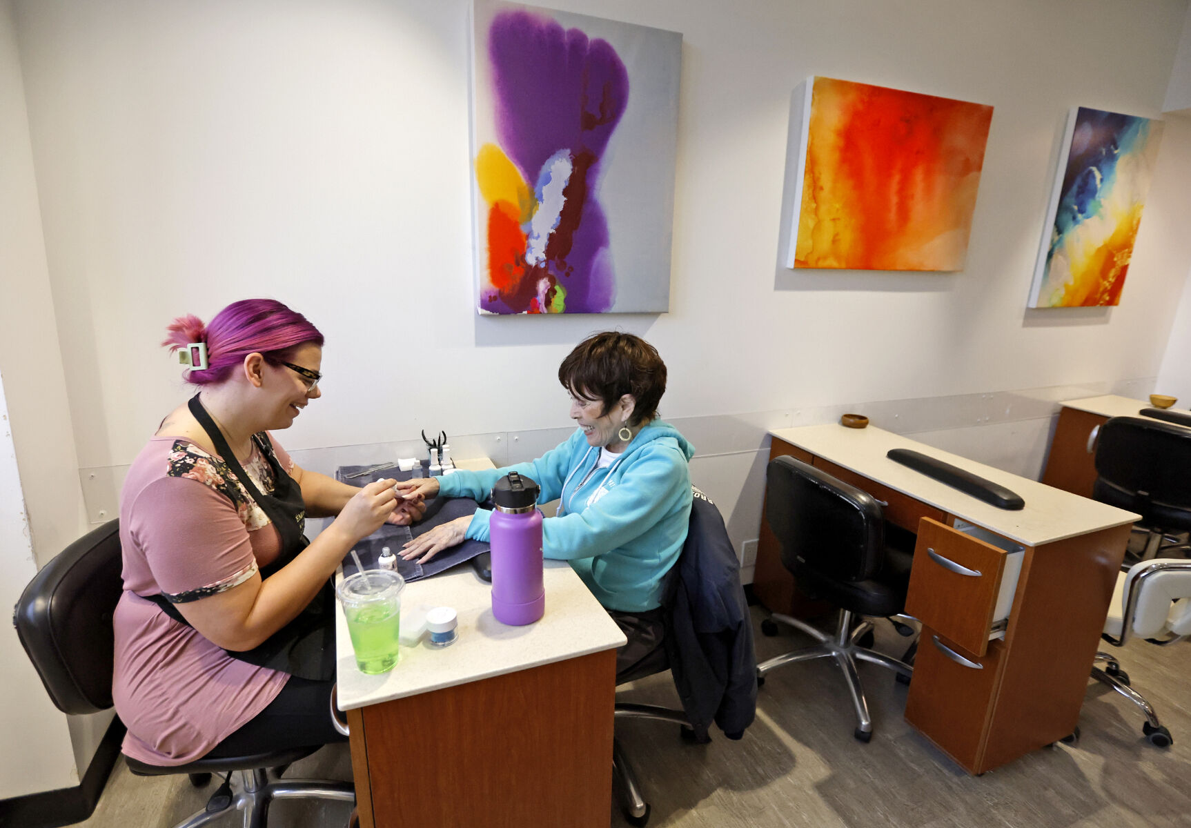 Katie Deininger (left), a cosmetologist at Body & Soul Wellness Center and Spa, gives a manicure to Jean Wuebbels, of Scales Mound, Ill.    PHOTO CREDIT: Jessica Reilly