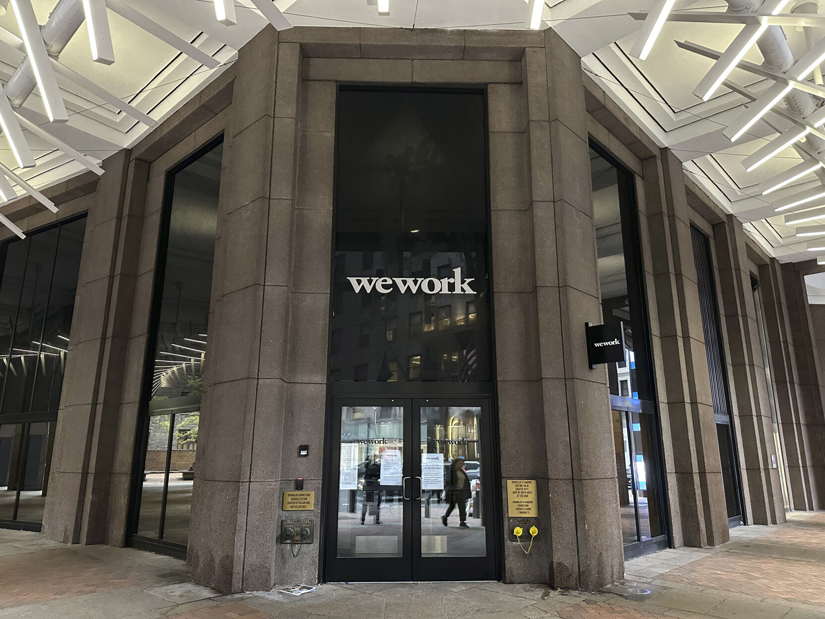 <p>The WeWork logo appears on a building exterior in New York on Tuesday, Nov. 7, 2023. WeWork has filed for Chapter 11 bankruptcy protection, marking a stunning fall for the office sharing company once seen as a Wall Street darling that promised to upend the way people went to work around the world. (AP Photo/Peter Morgan)</p>   PHOTO CREDIT: Peter Morgan - staff, ASSOCIATED PRESS
