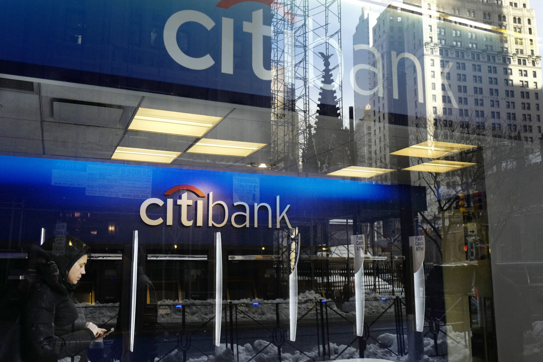 <p>FILE - In this March 16, 2017, file photo, a customer enters a Citibank branch, in New York. Citigroup intentionally discriminated against Armenian Americans when they applied for credit cards, the Consumer Financial Protection Bureau said Wednesday, Nov. 8, 2023. (AP Photo/Mark Lennihan, File)</p>   PHOTO CREDIT: Mark Lennihan 