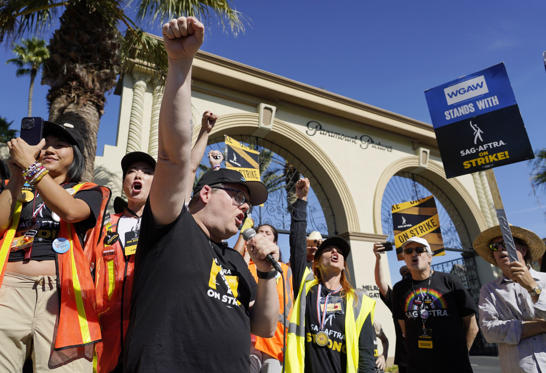 SAG-AFTRA chief negotiator Duncan Crabtree-Ireland, left, rallies striking actors in outside Paramount Pictures studio, Friday, Nov. 3, 2023, in Los Angeles. (AP Photo/Chris Pizzello)    PHOTO CREDIT: Associated Press