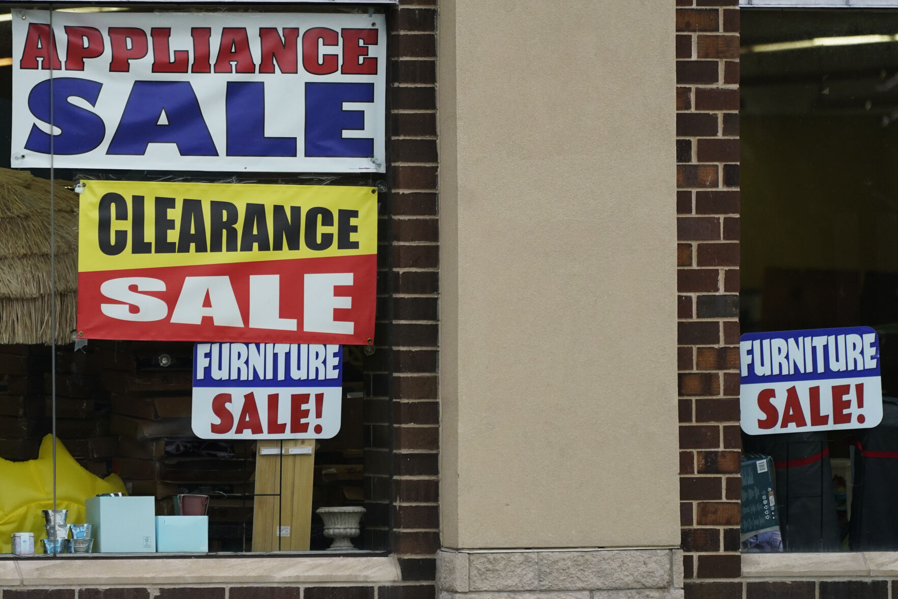 <p>Sale signs are displayed at an appliance store in Arlington Heights, Ill., Wednesday, Nov. 8, 2023. On Tuesday, the Labor Department issues its report on inflation at the consumer level in October. (AP Photo/Nam Y. Huh)</p>   PHOTO CREDIT: Nam Y. Huh