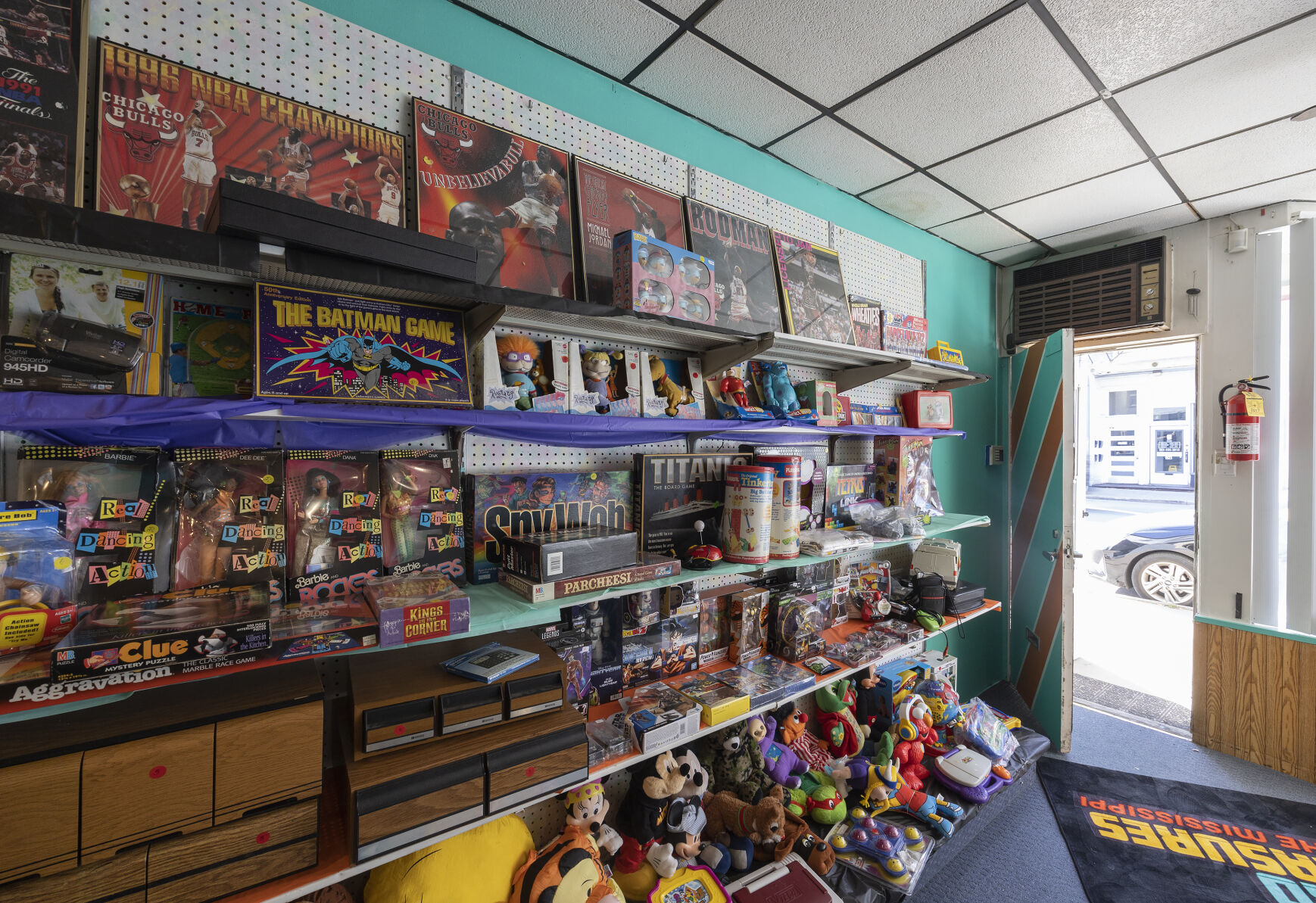 Vintage toys and games fill the shelves at Retro Treasures on the Mississippi on Central Avenue in Dubuque on Wednesday, Nov. 15, 2023.    PHOTO CREDIT: Stephen Gassman