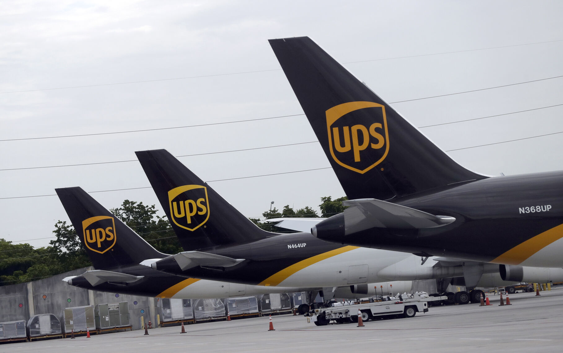 <p>FILE - In this July 27, 2020 file photo, the tails of three UPS aircraft are shown parked at Miami International Airport in Miami. Carriers like the U.S. Postal Service, FedEx and United Parcel Service have capacity to meet projected demand this holiday season, which is cheery news for shippers and shoppers alike. (AP Photo/Wilfredo Lee, File)</p>   PHOTO CREDIT: Wilfredo Lee - staff, ASSOCIATED PRESS