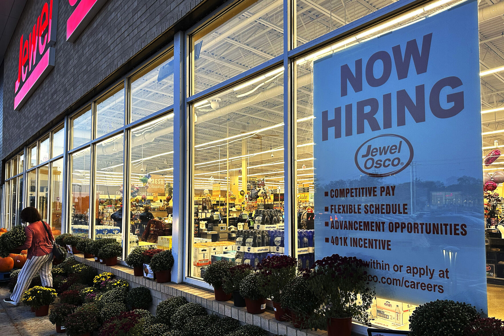 A hiring sign is displayed at a grocery store in Deerfield, Ill., Thursday, Oct. 5, 2023. On Wednesday, the Labor Department reports on the number of people who applied for unemployment benefits last week. (AP Photo/Nam Y. Huh)    PHOTO CREDIT: Associated Press