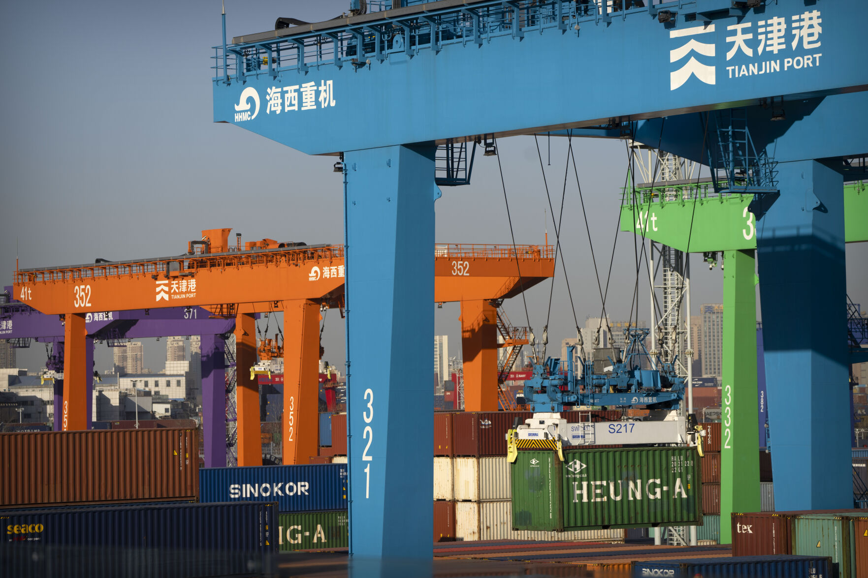 <p>File - A crane lifts a shipping container at an automated container port in Tianjin, China, Jan. 16, 2023. The global economy, which has proved surprisingly resilient this year, is expected to falter next year under the strain of wars, still-elevated inflation and continued high interest rates. (AP Photo/Mark Schiefelbein, File)</p>   PHOTO CREDIT: Mark Schiefelbein 