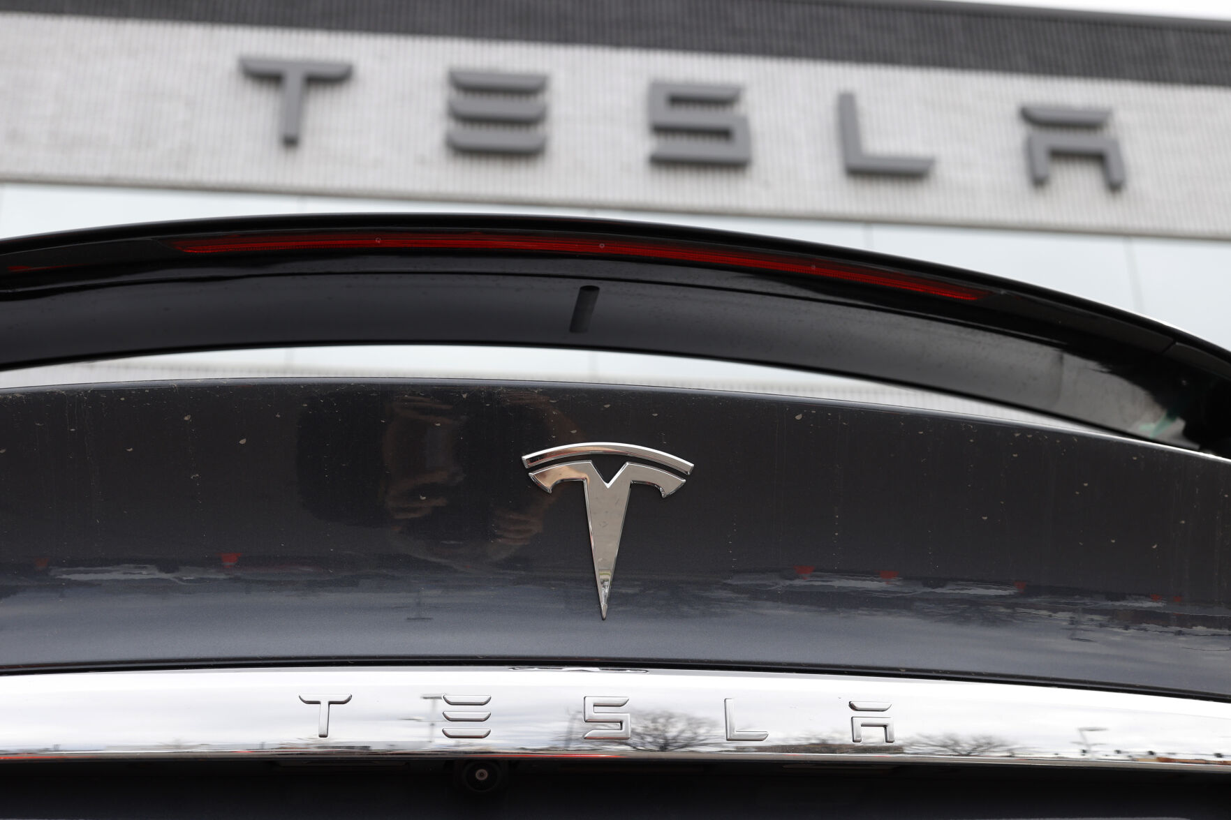 <p>FILE - The Tesla company logo shines off the rear deck of an unsold 2020 Model X at a Tesla dealership, April 26, 2020, in Littleton, Colo. Tesla is recalling more than 2 million vehicles across its model lineup to fix a defective system that’s supposed to ensure drivers are paying attention when they use Autopilot. Documents posted by U.S. safety regulators say the company will send out a software update to fix the problems. (AP Photo/David Zalubowski, File)</p>   PHOTO CREDIT: David Zalubowski 