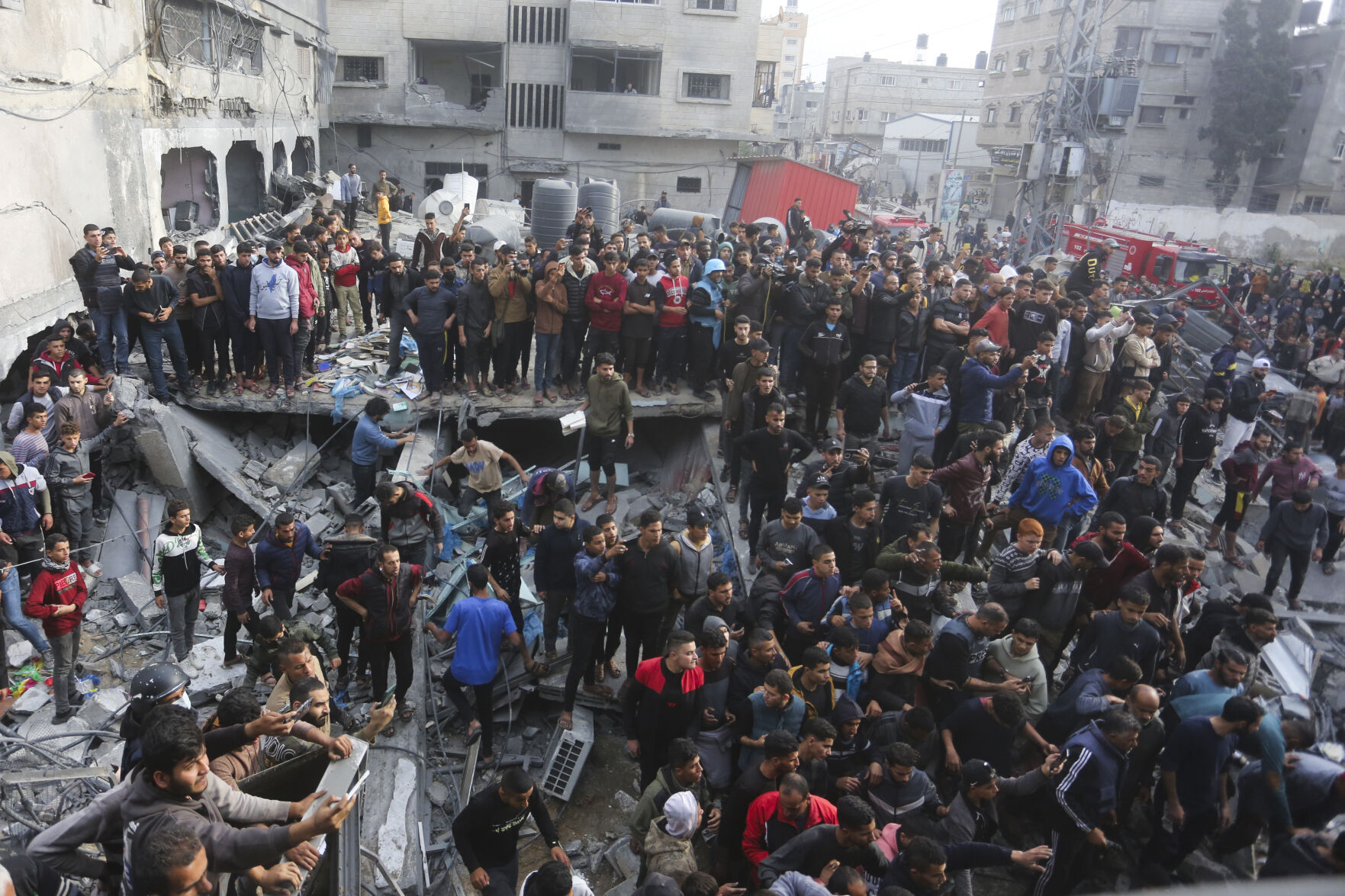 <p>Palestinians look at the destruction after an Israeli strike in Rafah, Gaza Strip, Wednesday, Dec. 20, 2023. (AP Photo/Hatem Ali)</p>   PHOTO CREDIT: Hatem Ali - stringer, ASSOCIATED PRESS