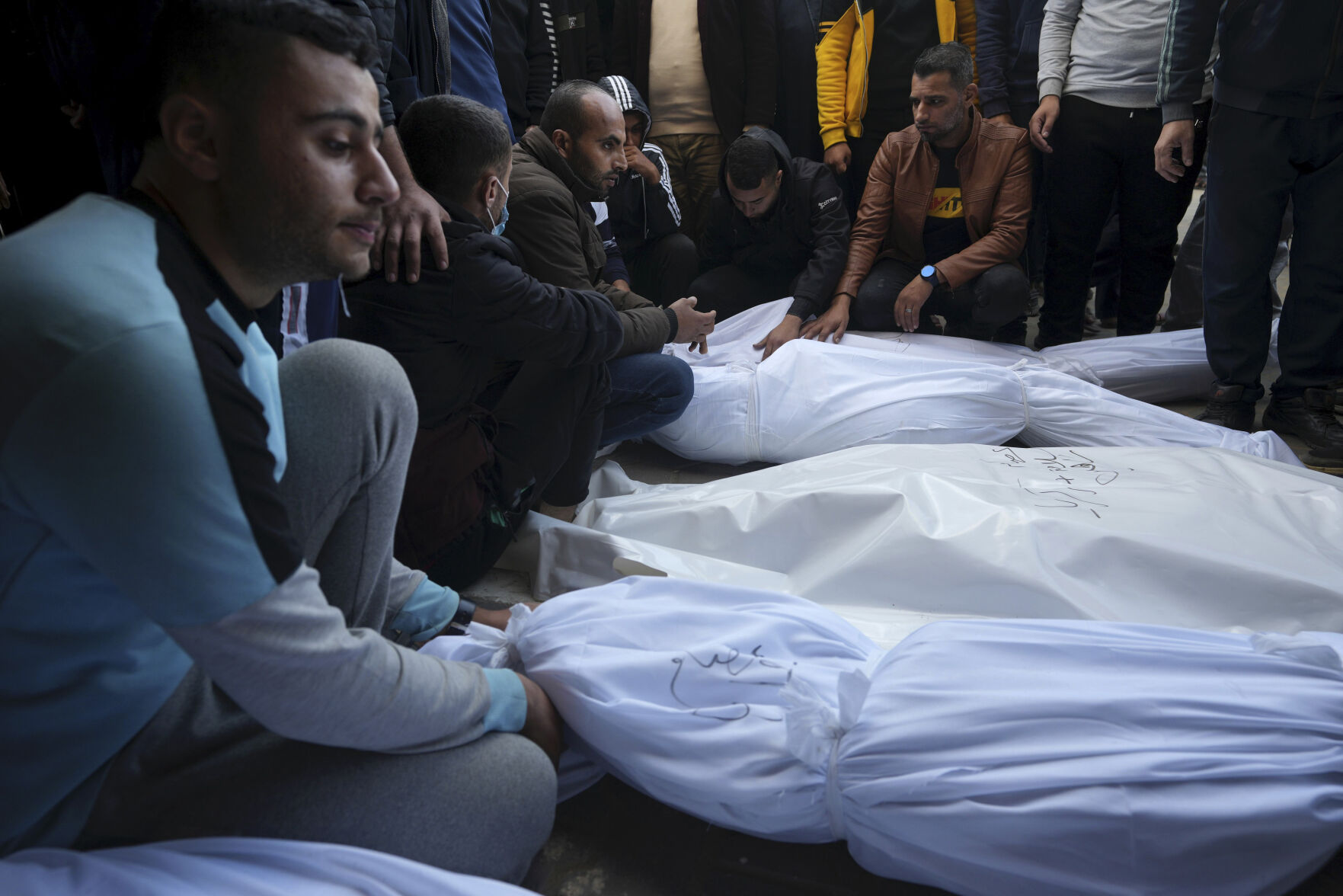 <p>Palestinians mourn their relatives killed in the Israeli bombardment of the Gaza Strip in Deir al Balah on Wednesday, Dec. 20, 2023. (AP Photo/Adel Hana)</p>   PHOTO CREDIT: Adel Hana - staff, ASSOCIATED PRESS