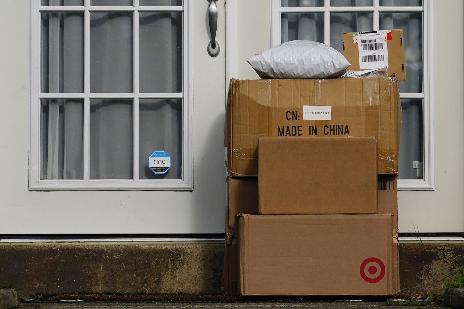 <p>File - Packages are stacked on the doorstep of a home on Oct. 27, 2021, in Upper Darby, Pa. Retailers and delivery companies have been trying to combat the theft of delivered packages in a variety of ways. (AP Photo/Matt Slocum, File)</p>   PHOTO CREDIT: Matt Slocum 
