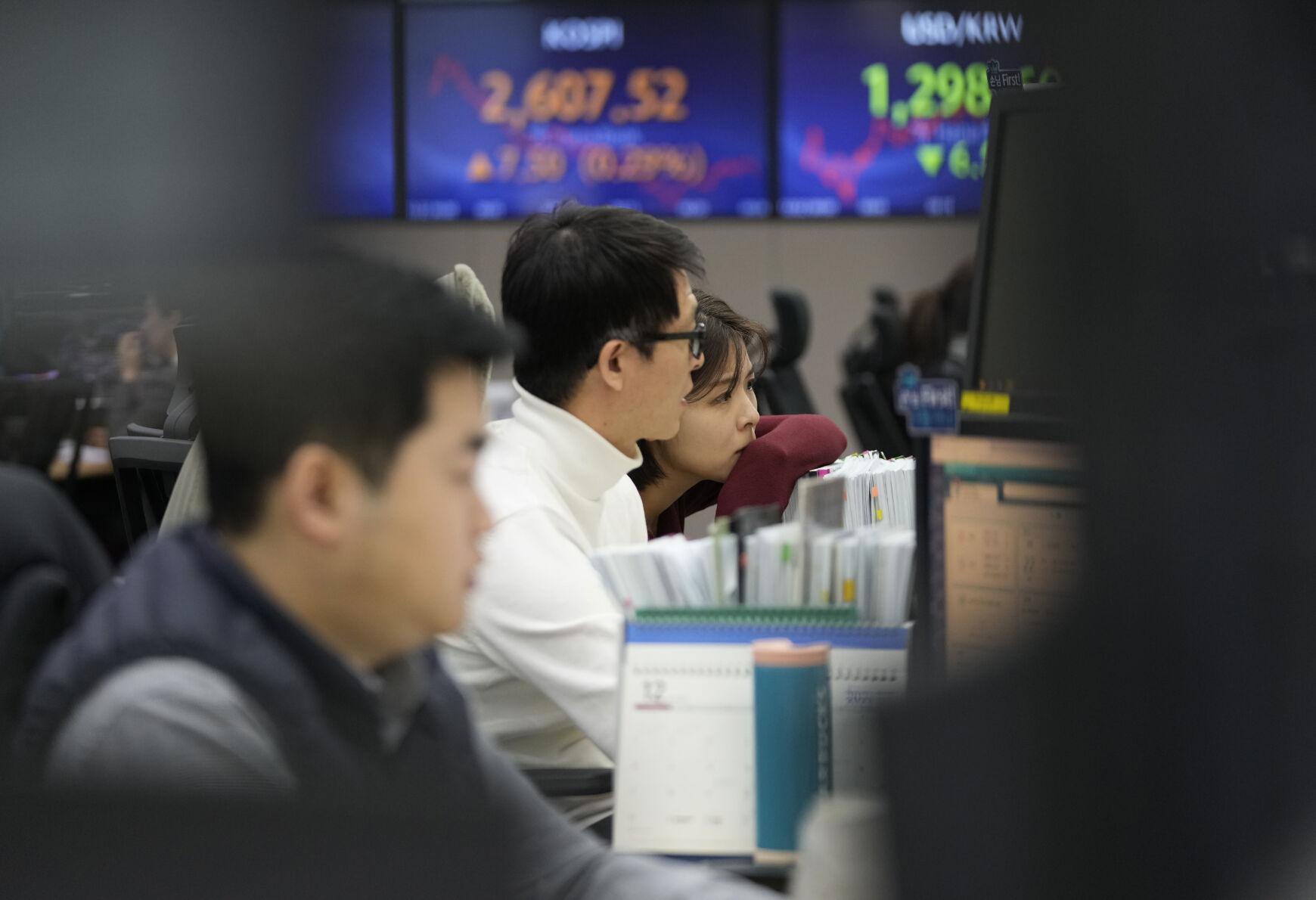 <p>Currency traders watch monitors at the foreign exchange dealing room of the KEB Hana Bank headquarters in Seoul, South Korea, Friday, Dec. 22, 2023. Shares were mostly higher in Asia on Friday after several strong profit reports helped Wall Street claw back most of its sharp loss from day before. (AP Photo/Ahn Young-joon)</p>   PHOTO CREDIT: Ahn Young-joon - staff, ASSOCIATED PRESS