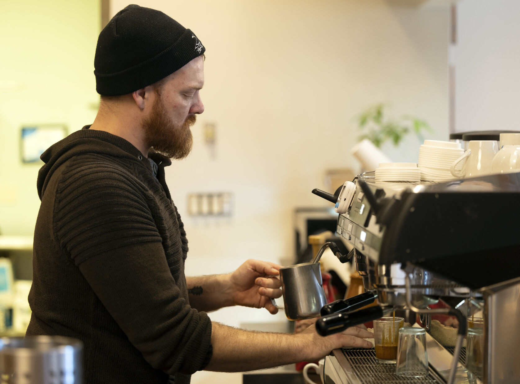 Owner Darin Shireman makes a latte at Wayfarer Coffee.    PHOTO CREDIT: Stephen Gassman