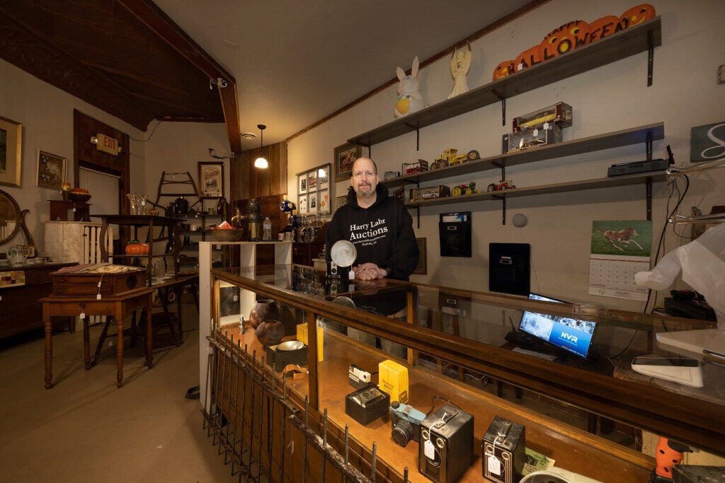 Owner Trelane Hoeper appears behind the counter at 3rd-Generation Antiques in Cuba City, Wis., on Friday.    PHOTO CREDIT: Stephen Gassman