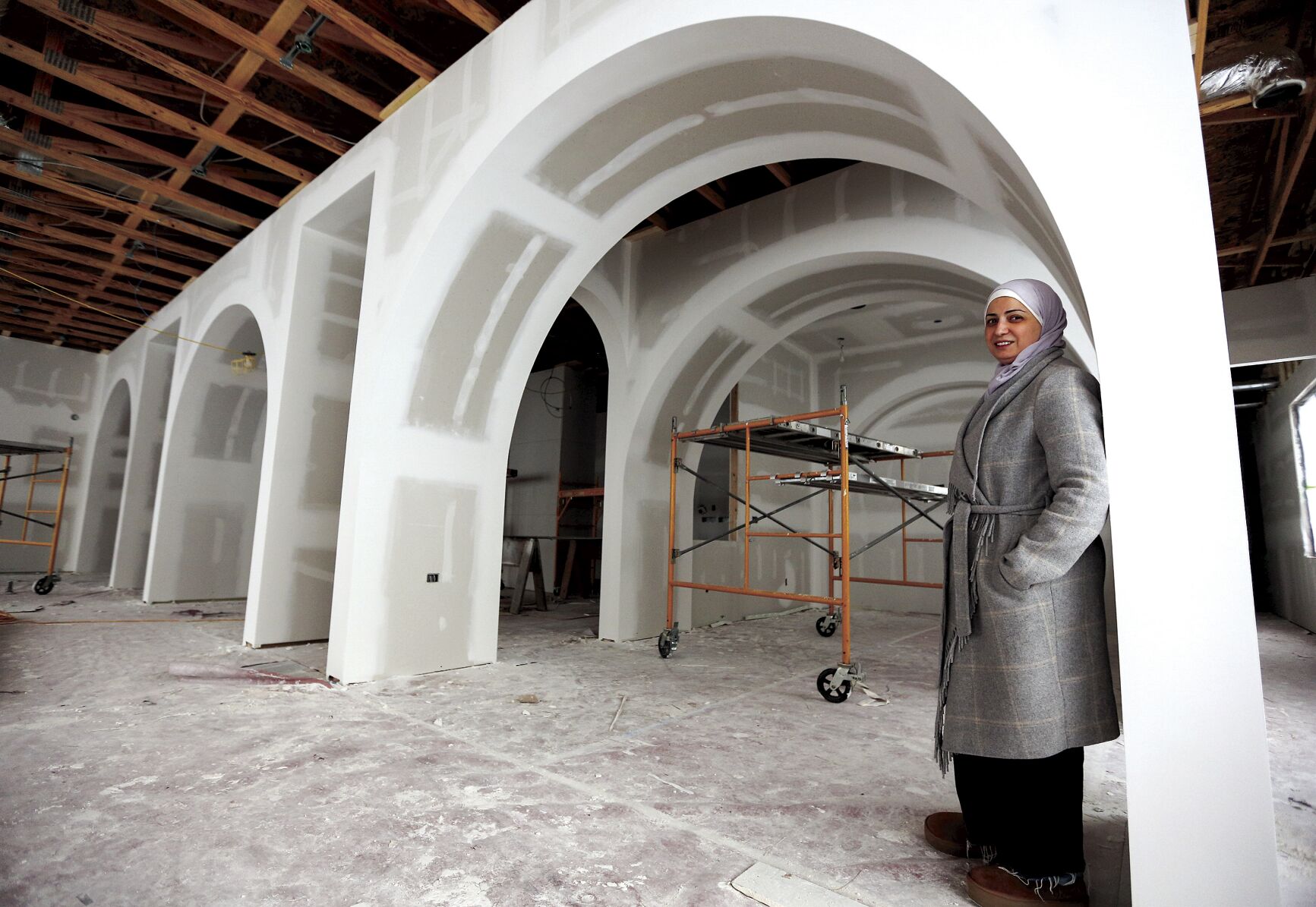 Co-owner Yaman Salim shows the remodeling progress on Roses & Berries Cafe, which is set to open at the end of January at 4340 Asbury Road. The cafe will include a mix of Middle Eastern dishes and French pastries.    PHOTO CREDIT: Dave Kettering