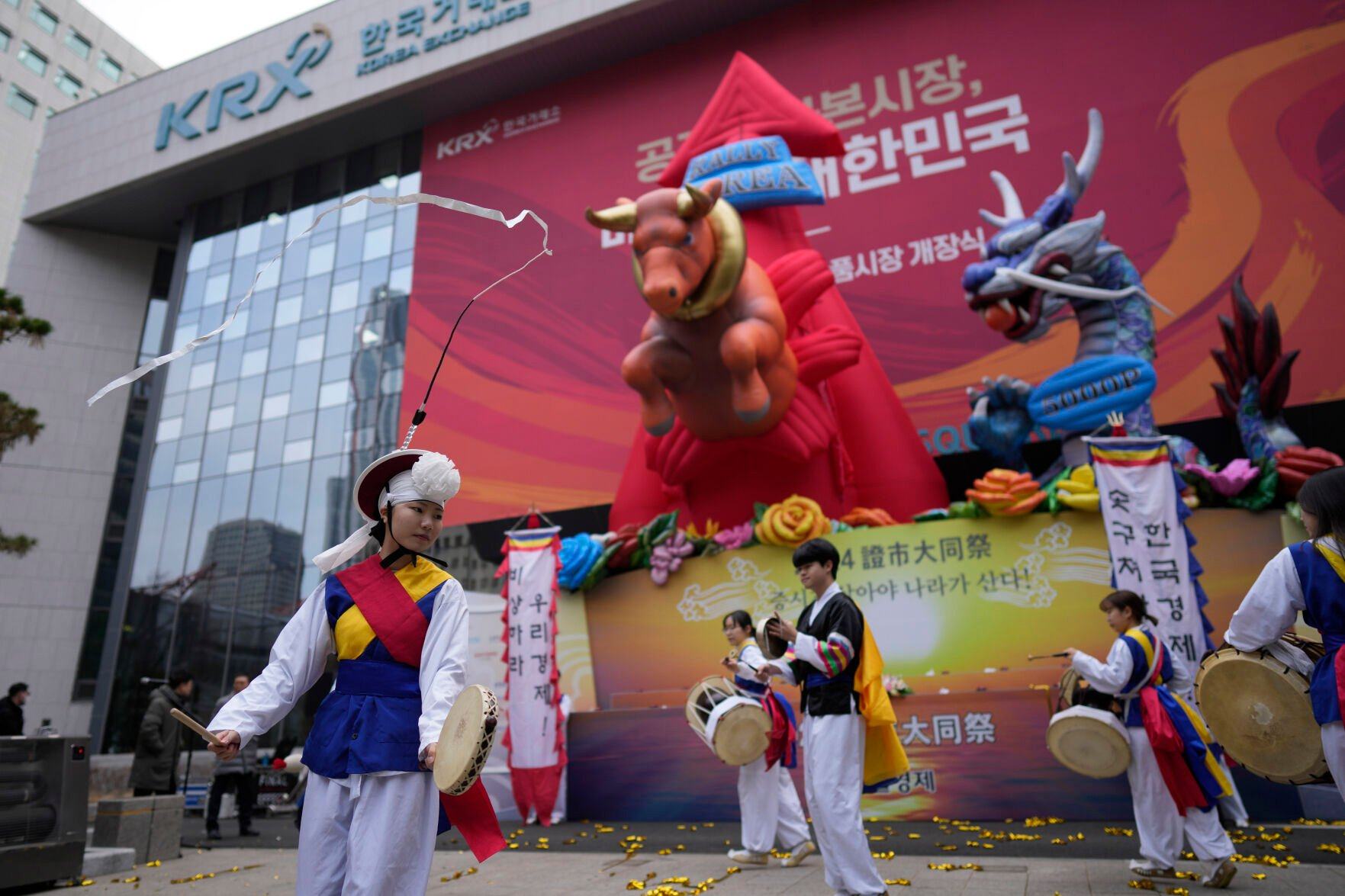 <p>Dancers in traditional costumes perform to celebrate the opening for the Year 2024 trading outside of the Korea Exchange in Seoul, South Korea, Tuesday, Jan. 2, 2024. (AP Photo/Lee Jin-man)</p>   PHOTO CREDIT: Lee Jin-man - staff, ASSOCIATED PRESS