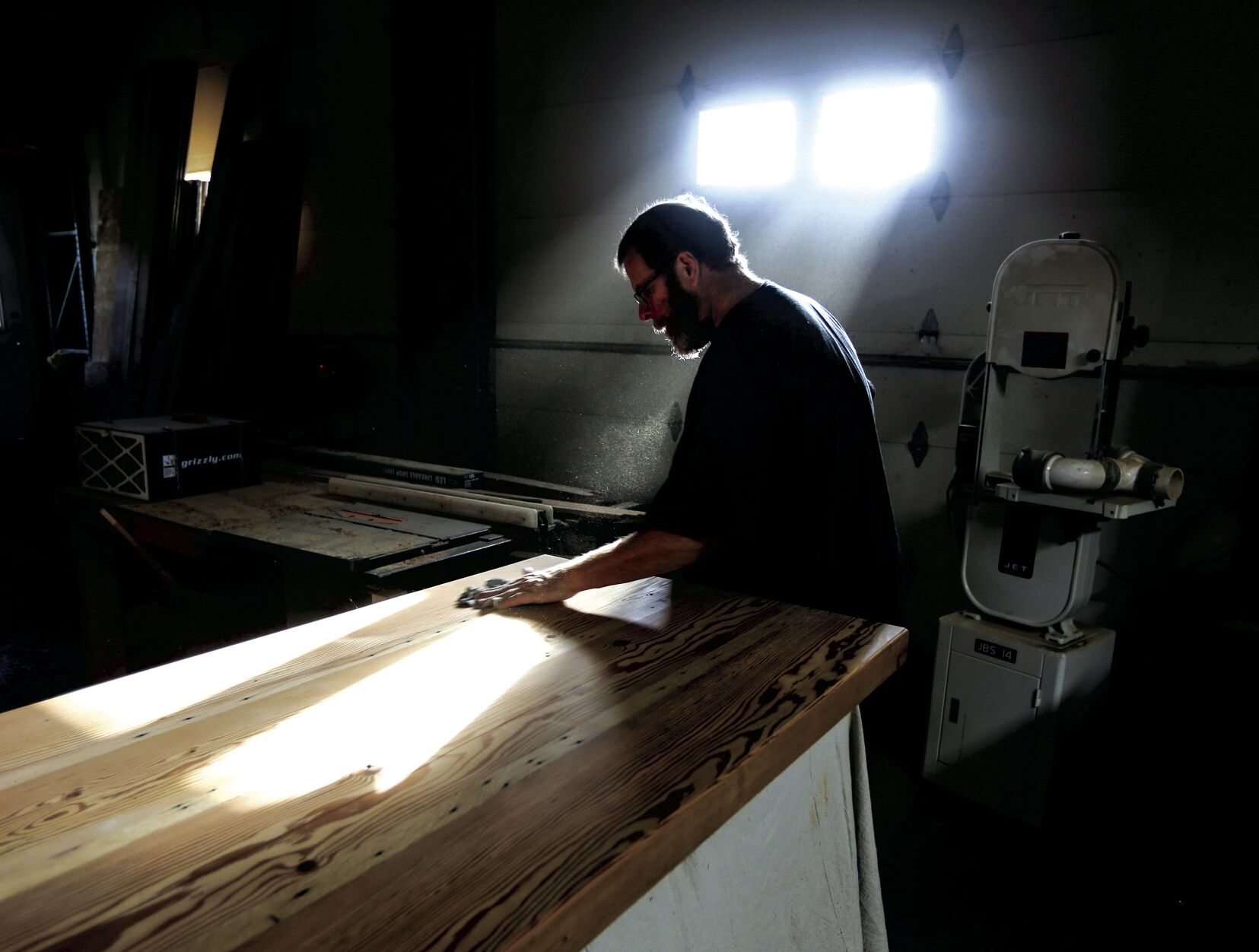Randy Reeves works on a project in the woodworking shop at Renewed Visions — Across the Bridge in Manchester, Iowa, on Friday.    PHOTO CREDIT: Dave Kettering