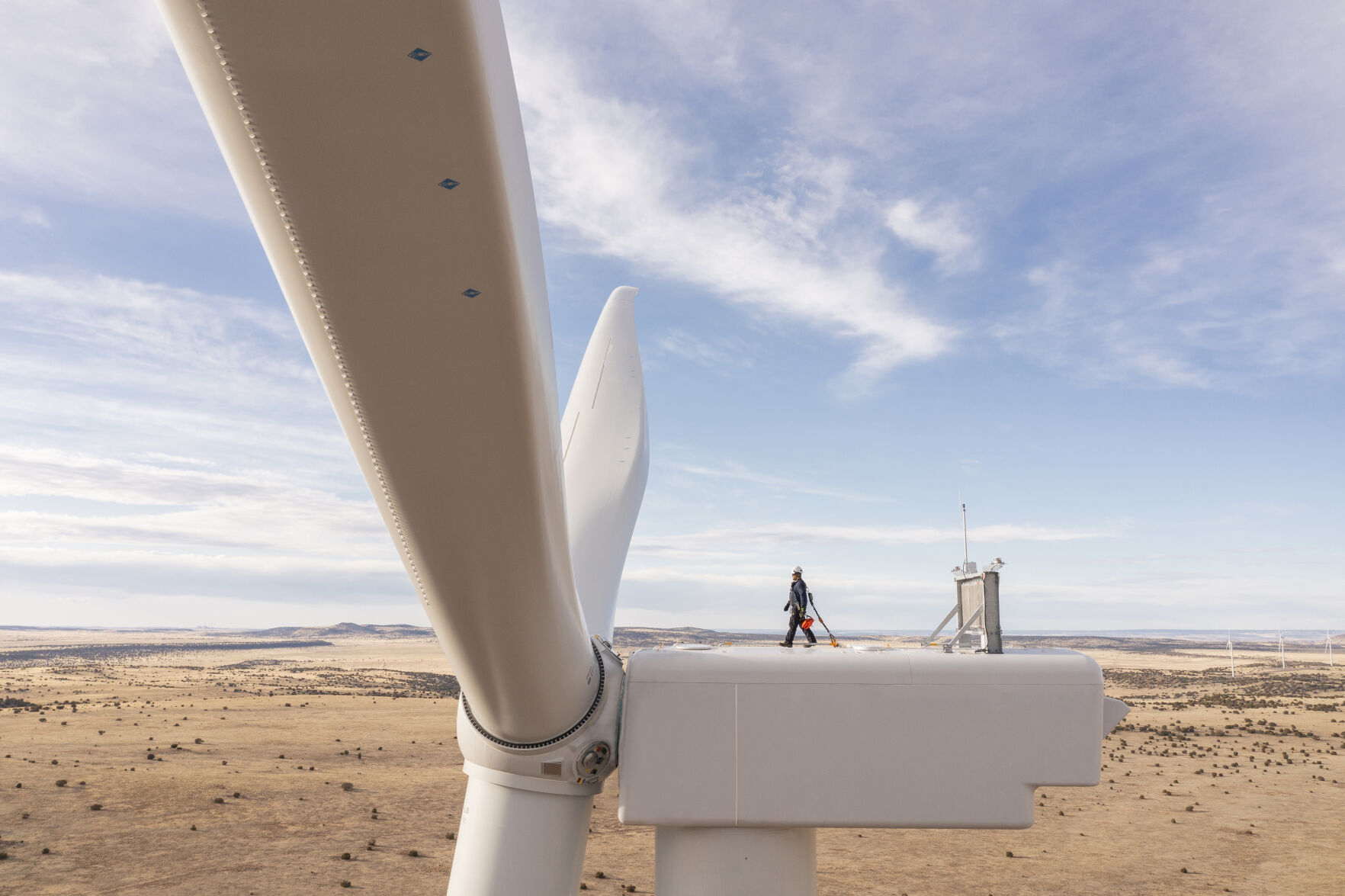 <p>This undated image provided by GE Vernova shows a worker atop a wind turbine at the Borderland Wind Project in western New Mexico near the Arizona state line. GE Vernova has received a record order for 674 turbines that will be used for the SunZia Wind Project in central New Mexico, which is expected to be the largest wind farm in the Western Hemisphere when it comes online in 2026. (Rich Crowder/GE Vernova via AP)</p>   PHOTO CREDIT: Rich Crowder -