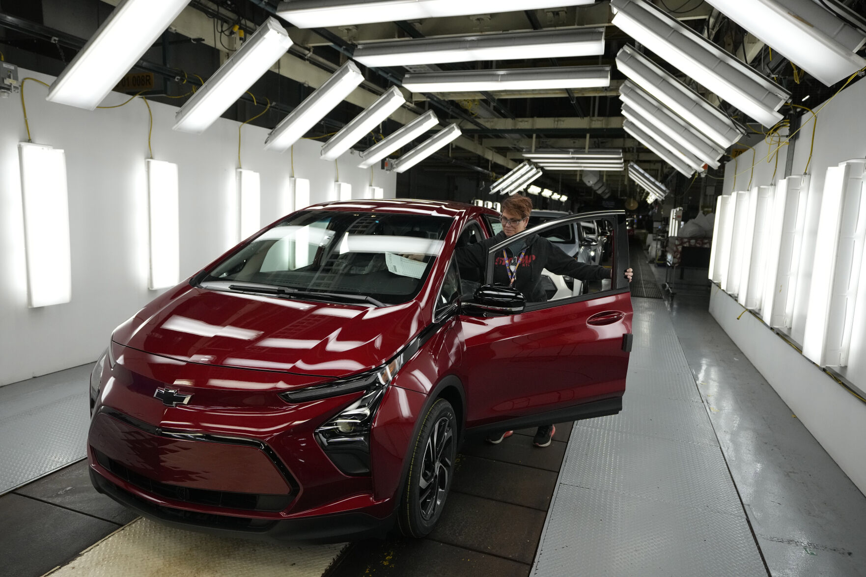 <p>File - Assembly line worker Janice DeBono looks over a 2023 Chevrolet Bolt EUV at the General Motors Orion Assembly, June 15, 2023, in Lake Orion, Mich. Government tallies show only 11 of the more than 50 EVs on sale in the U.S. are eligible for tax credits so far this year. Still qualifying for credits are the Tesla Model Y SUV, Chevrolet Bolt compact car and Rivian R1T pickup truck. (AP Photo/Carlos Osorio, File)</p>   PHOTO CREDIT: Carlos Osorio 