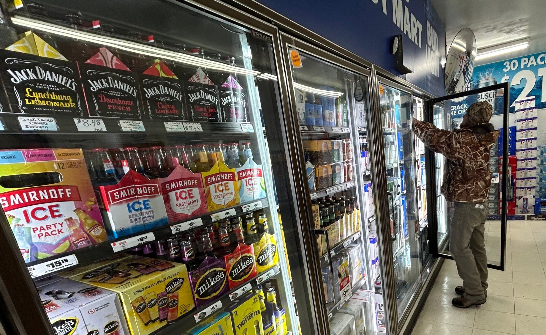 Dustin Crane, of Wisconsin Distributors, checks inventory recently at Speedy Mart in Fennimore, Wis.    PHOTO CREDIT: Erik Hogstrom
Telegraph Herald