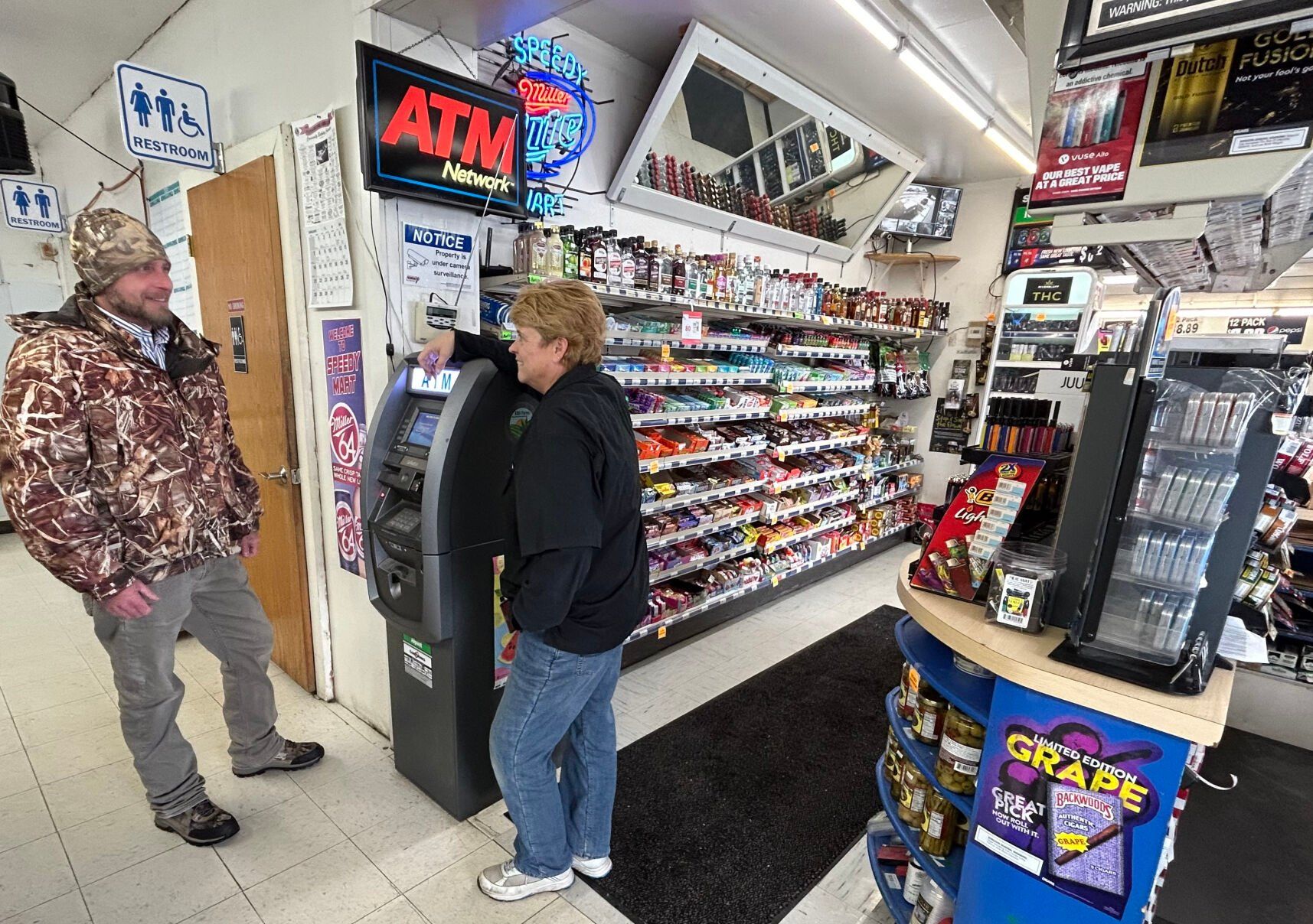 Dustin Crane, of Wisconsin Distributors, speaks with Speedy Mart owner Angie Faith recently in the Fennimore, Wis., convenience store. Faith purchased the store from her parents in 2007, and the store is in its 52nd year of business.    PHOTO CREDIT: Erik Hogstrom
Telegraph Herald