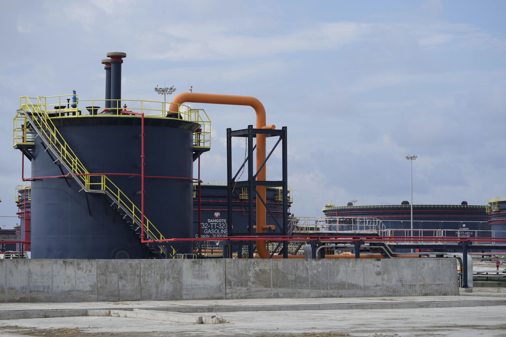 <p>FILE - A view of oil installations at the Dangote refinery during the opening ceremony in Lagos, Nigeria, Monday, May 22, 2023. Nigeria’s Dangote Petroleum Refinery, which is Africa’s biggest, says it has begun production, starting with diesel and aviation fuel. This brings to an end a yearslong wait for a plant that analysts said Monday, Jan. 15, 2024 could boost local and regional refining capacity in a region heavily reliant on imported refined products. (AP Photo/Sunday Alamba, File)</p>   PHOTO CREDIT: Sunday Alamba 