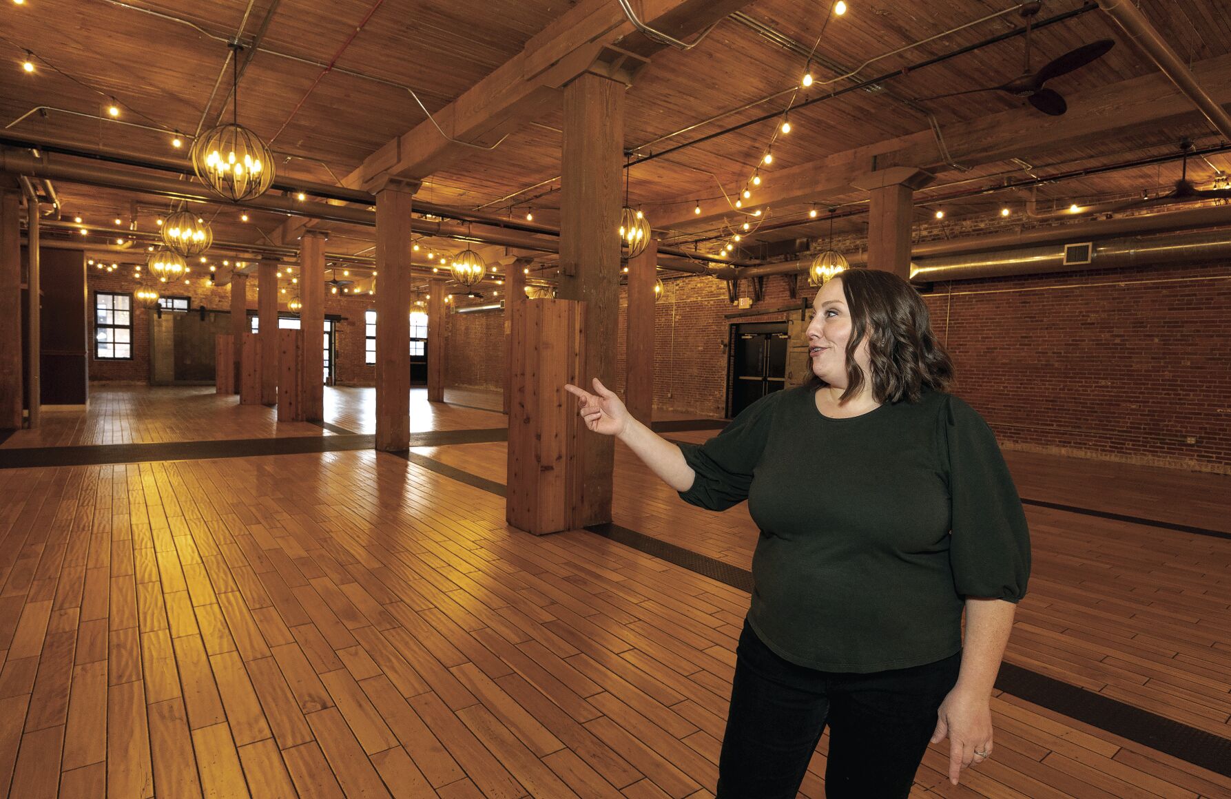 Kelly Hall, 7 Hills Brewing Company Director of Events, shows off the new event space Wednesday in Dubuque