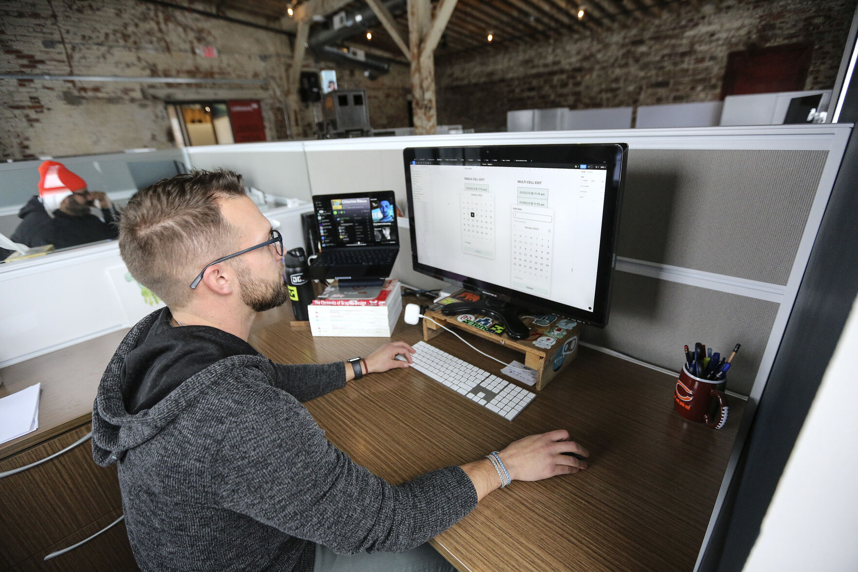 Eric Peters, of Dubuque, works remotely at the Innovation Lab