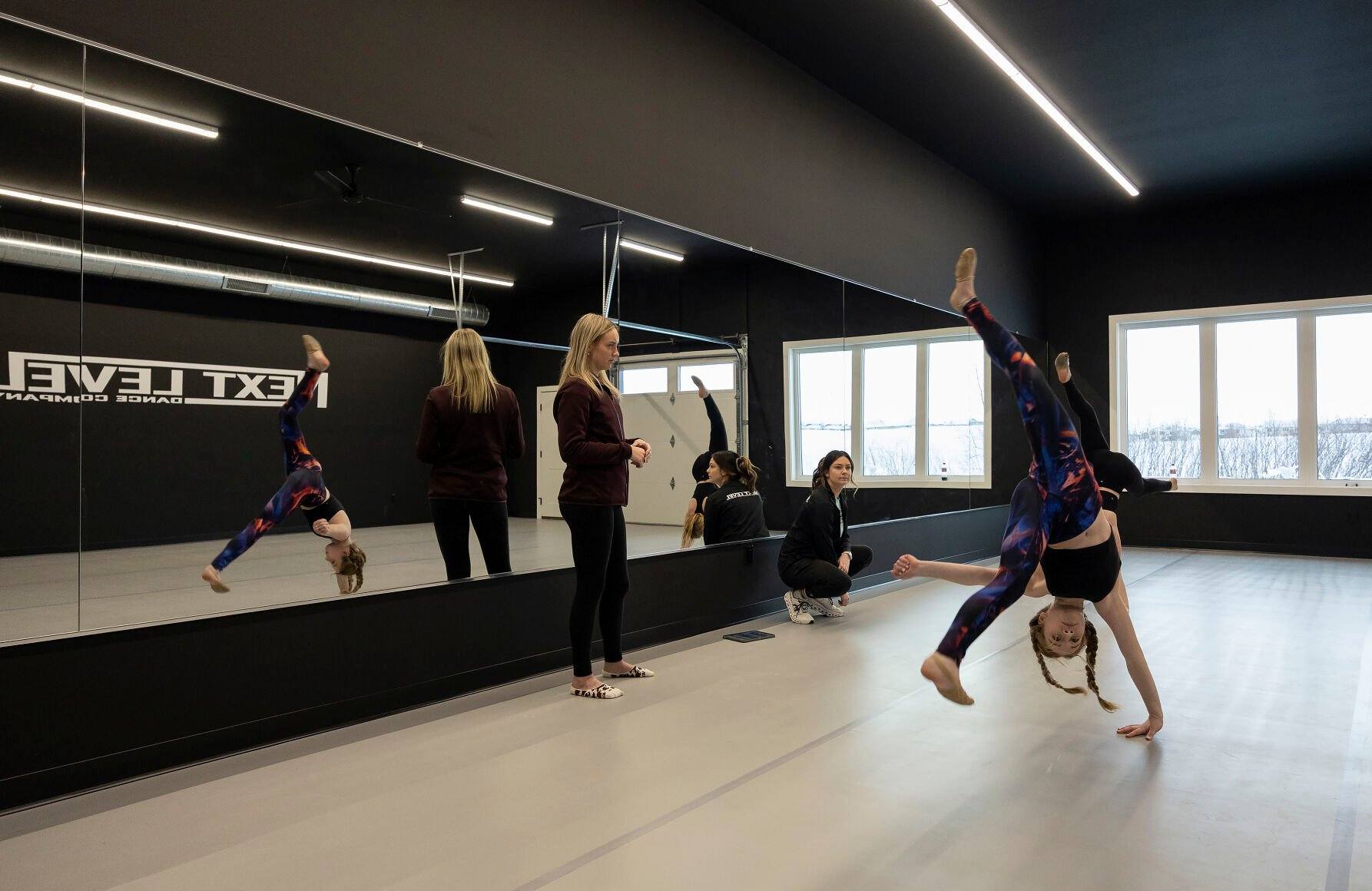 Instructors watch as students rehearse at Next Level Dance Company in Peosta, Iowa, on Monday, Jan. 15, 2024.    PHOTO CREDIT: Stephen Gassman